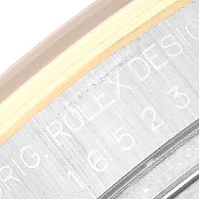 This close-up angle shows the engraved model number and branding on the Rolex Daytona 16523 Men's Steel and Gold (two tone) Black Dial 16523 Men's Steel and Gold (two tone) Black Dial watch case.