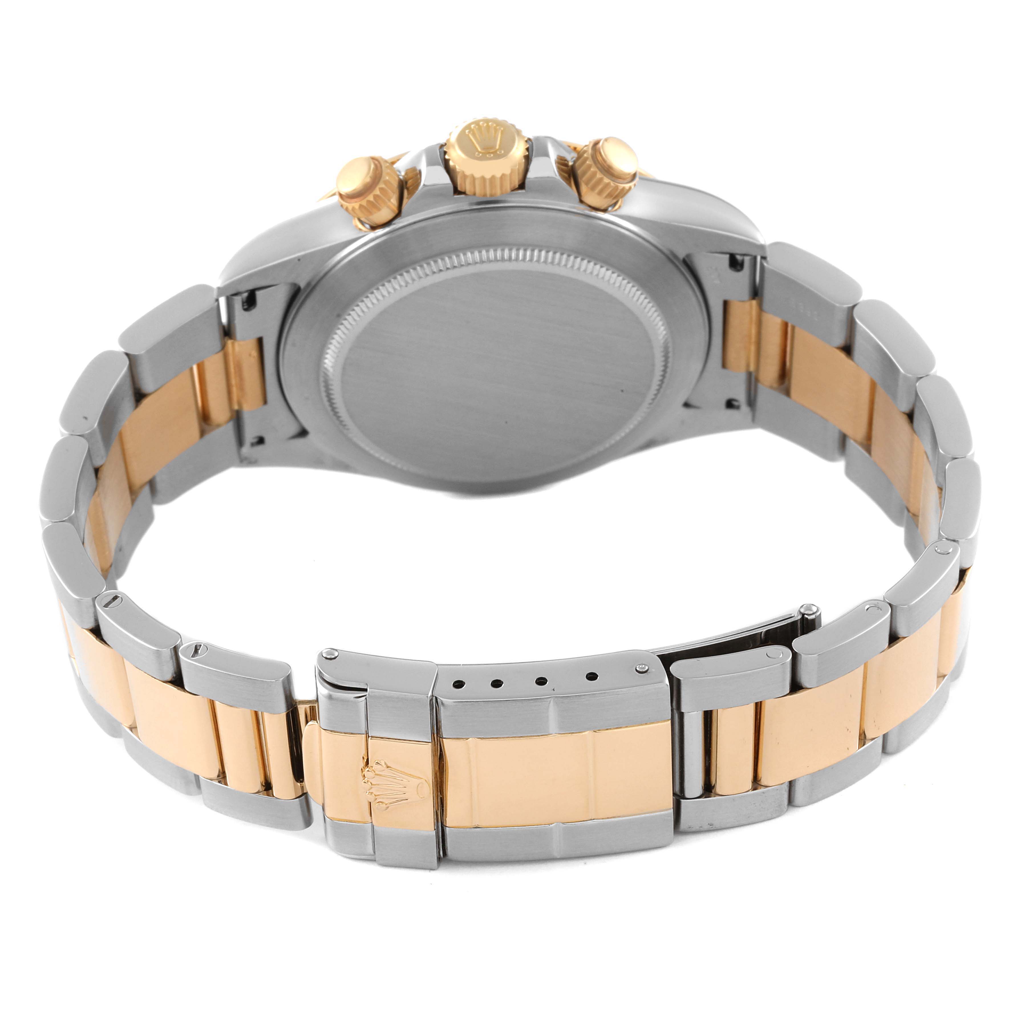 The image shows the back case and bracelet of a Rolex Daytona 16523 Men's Steel and Gold (two tone) Black Dial 16523 Men's Steel and Gold (two tone) Black Dial watch, highlighting the clasp and side buttons.