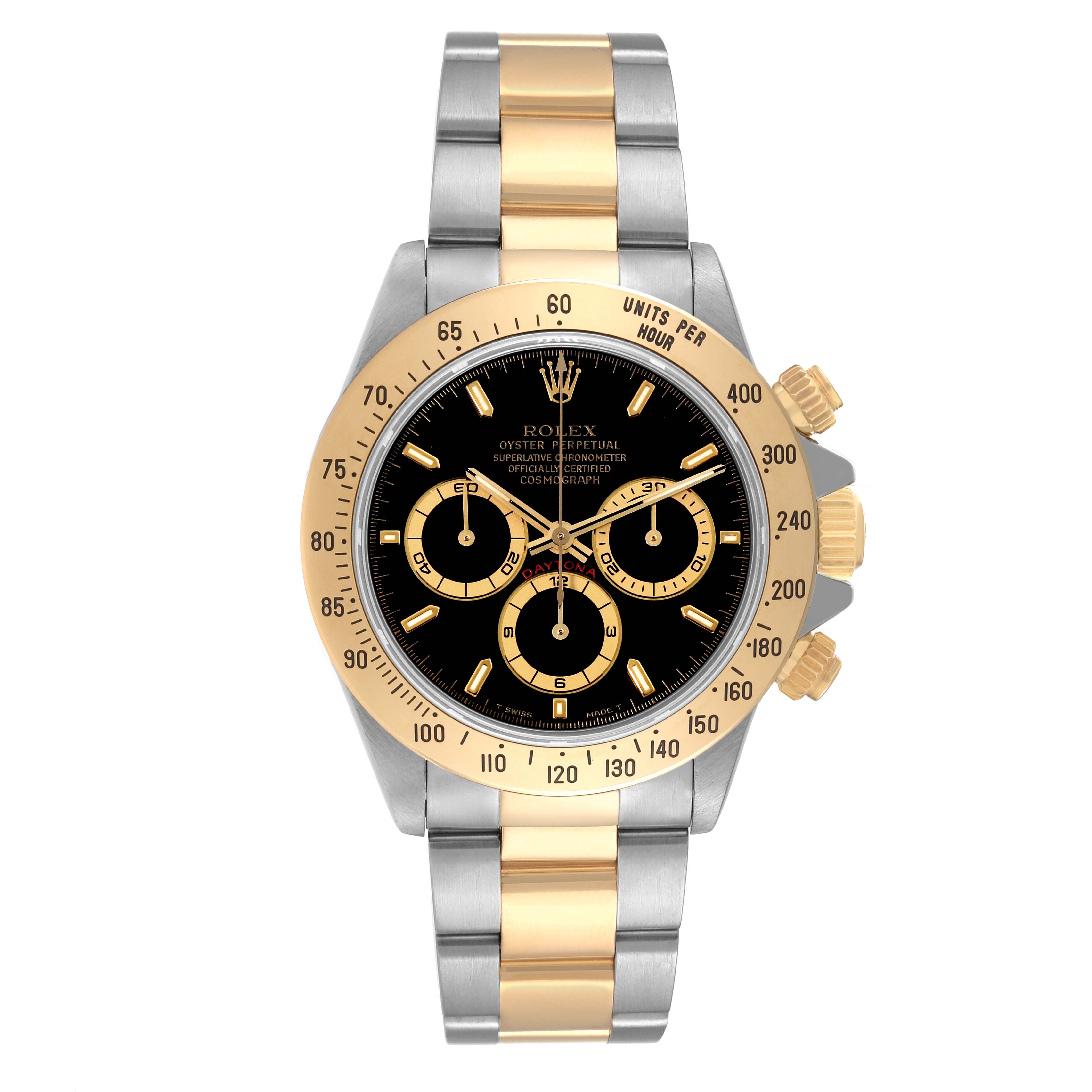 The image shows a front view of a Rolex Daytona 16523 Men's Steel and Gold (two tone) Black Dial 16523 Men's Steel and Gold (two tone) Black Dial watch, prominently displaying its gold bezel, black dial, and two-tone bracelet.
