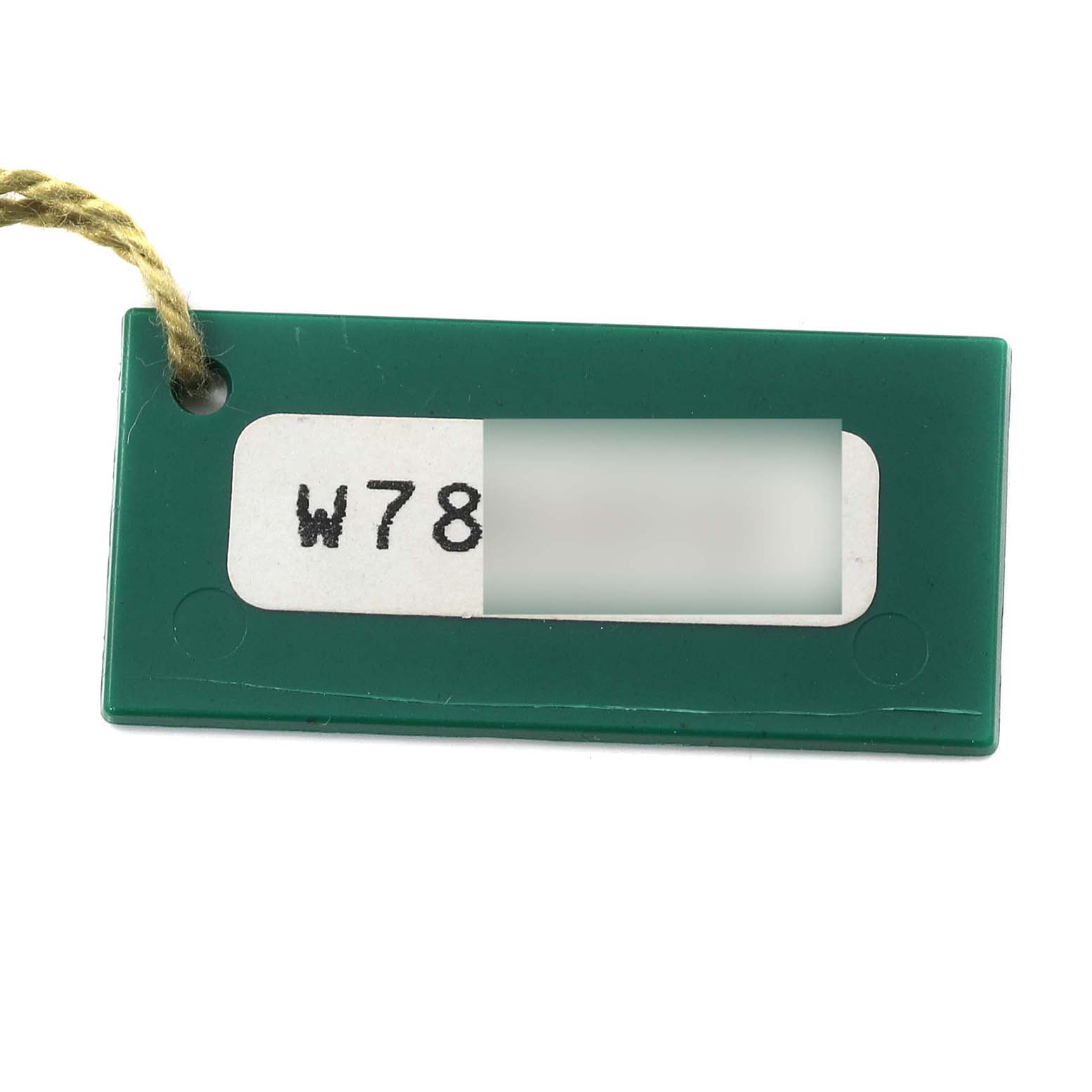 The image shows a green Rolex Daytona 16523 Men's Steel and Gold (two tone) Black Dial 16523 Men's Steel and Gold (two tone) Black Dial model tag with a rope, displaying a partial serial number.