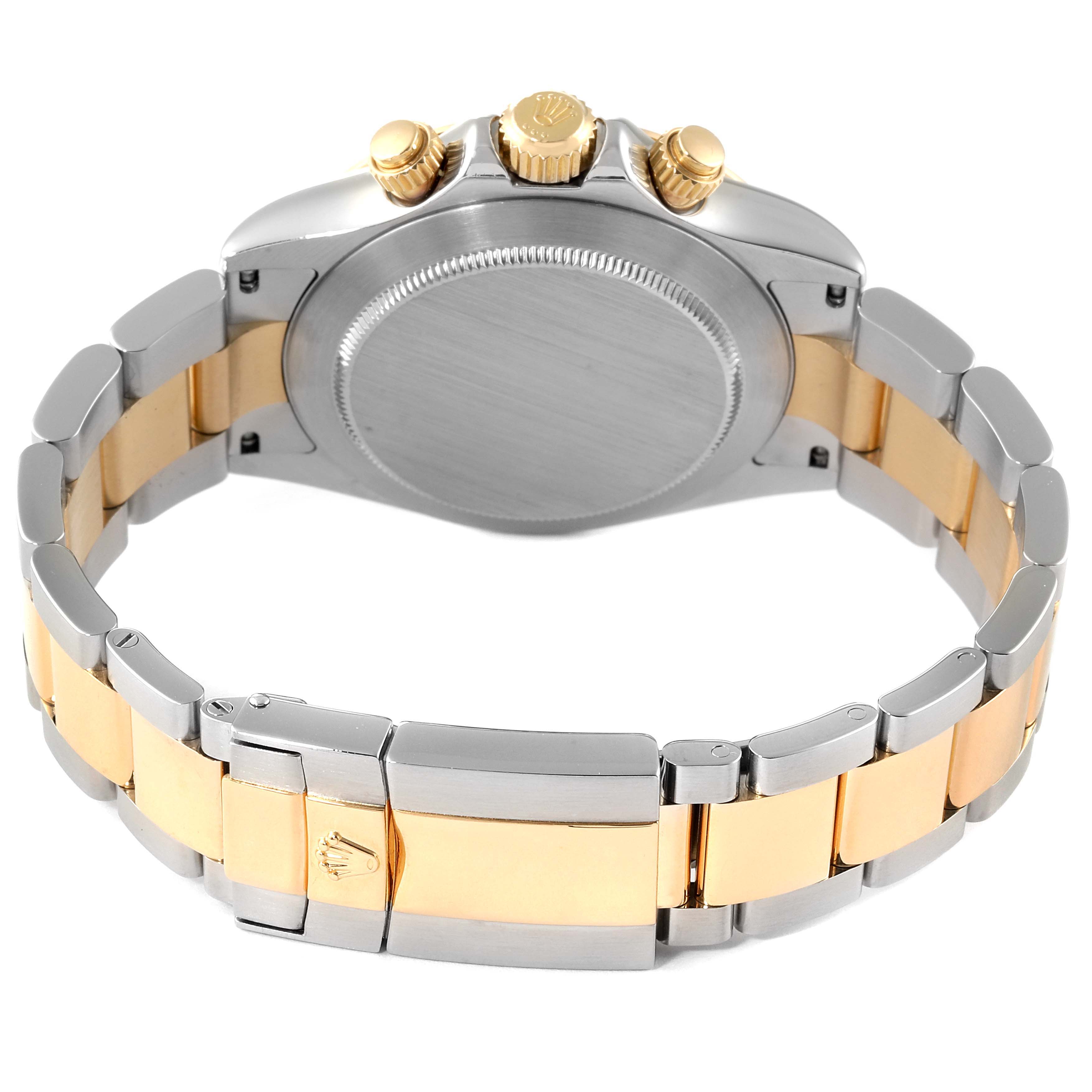 This image shows the back of a Rolex Daytona 116523 Men
s Steel and Gold (two tone) White Dial 116523 Men
s Steel and Gold (two tone) White Dial watch, highlighting the two-tone bracelet and the case back.
