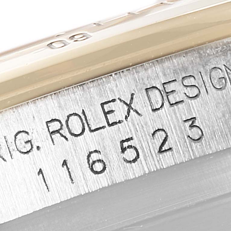 This image shows a close-up of the serial number engraving on a Rolex Daytona 116523 Men
s Steel and Gold (two tone) White Dial 116523 Men
s Steel and Gold (two tone) White Dial watch.