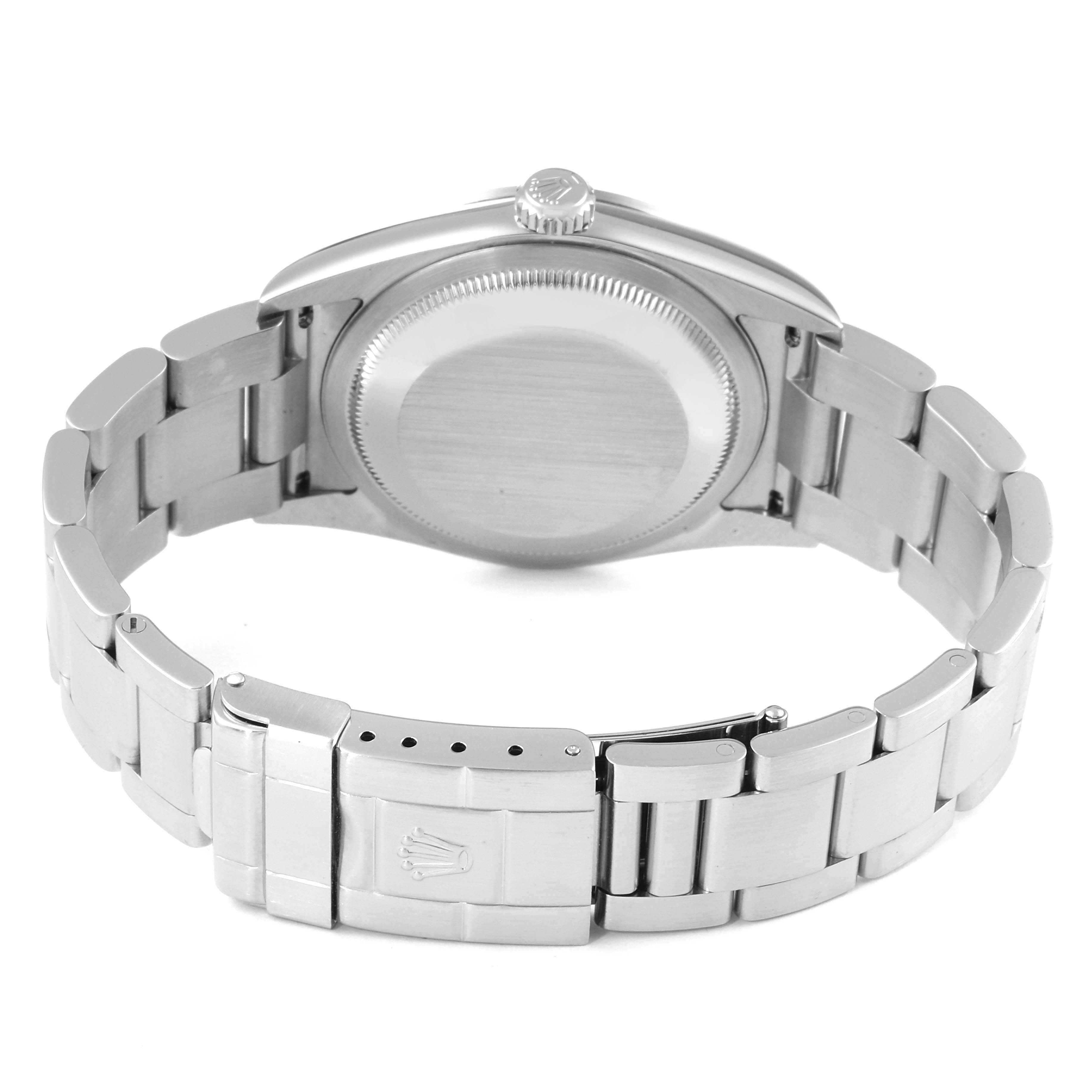 The image shows the back view of a Rolex Explorer 114270 Men's Stainless Steel Black Dial 114270 Men's Stainless Steel Black Dial watch, highlighting the case back, crown, and metal bracelet with the clasp.