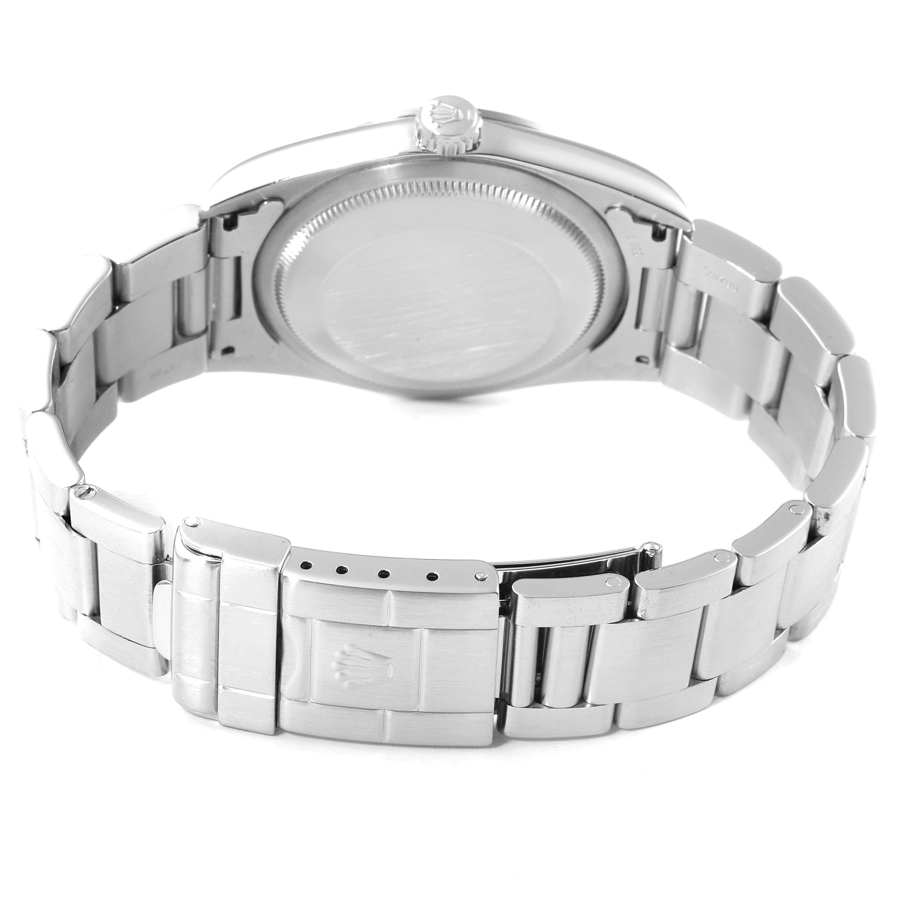 This image shows the back of a Rolex Explorer 14270 Men
s Stainless Steel Black Dial 14270 Men
s Stainless Steel Black Dial watch, highlighting the case back and metal bracelet with a clasp.