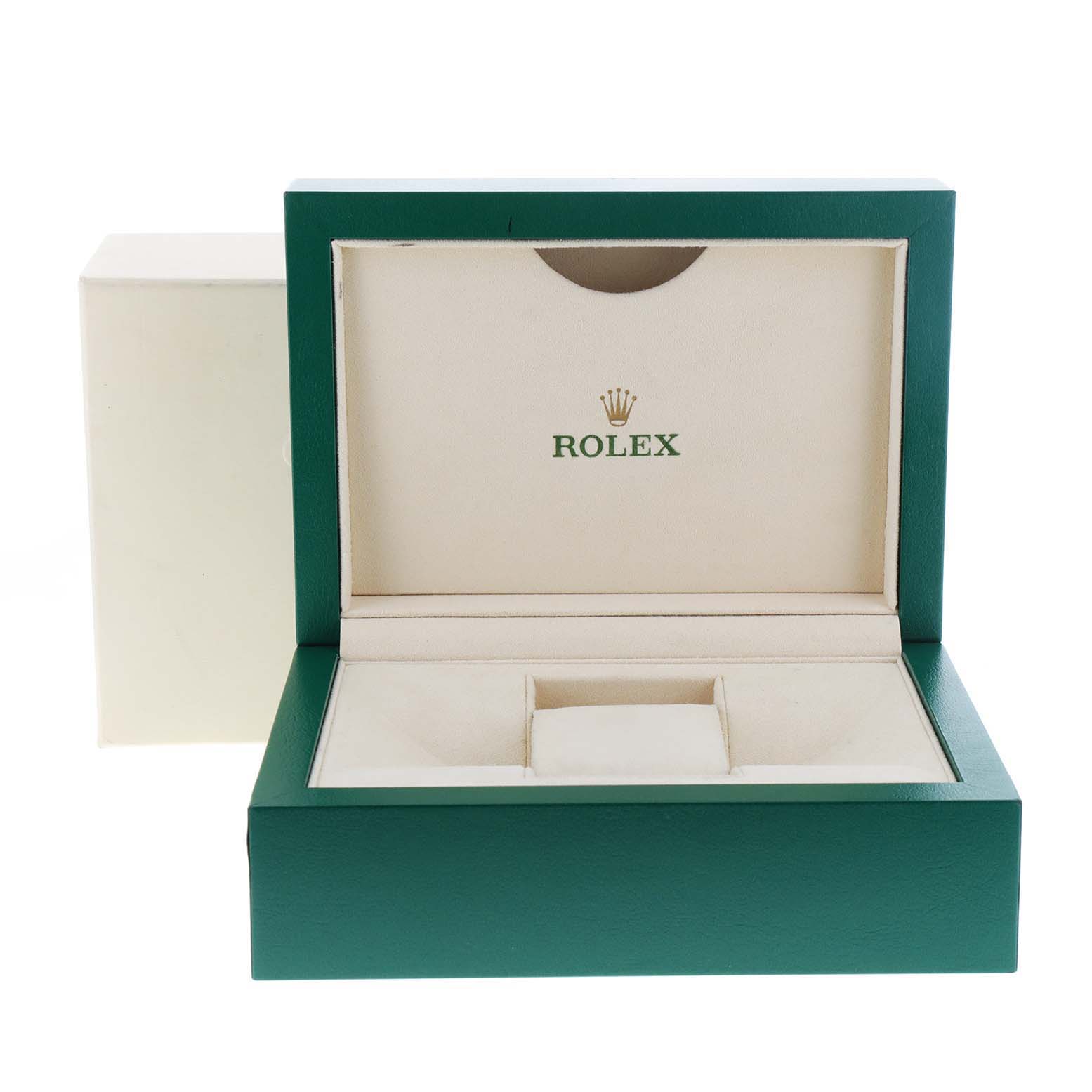 This image shows an open presentation box for a Rolex Explorer 214270 Men
s Stainless Steel Black Dial 214270 Men
s Stainless Steel Black Dial watch, highlighting its interior compartments and the Rolex logo.