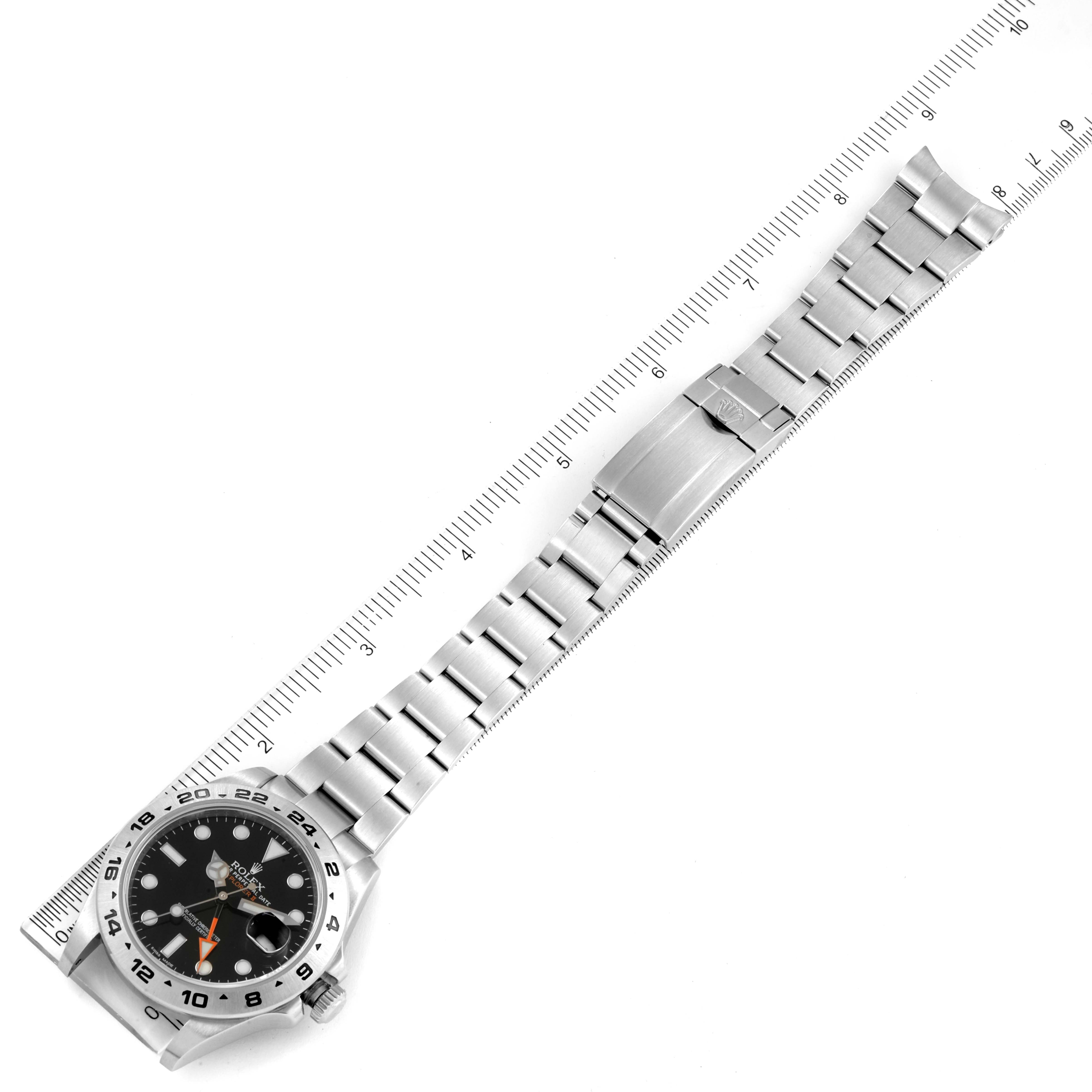 The image shows a Rolex Explorer 216570 Men's Stainless Steel Black Dial 216570 Men's Stainless Steel Black Dial watch laid out flat with a ruler beside it for measurement.