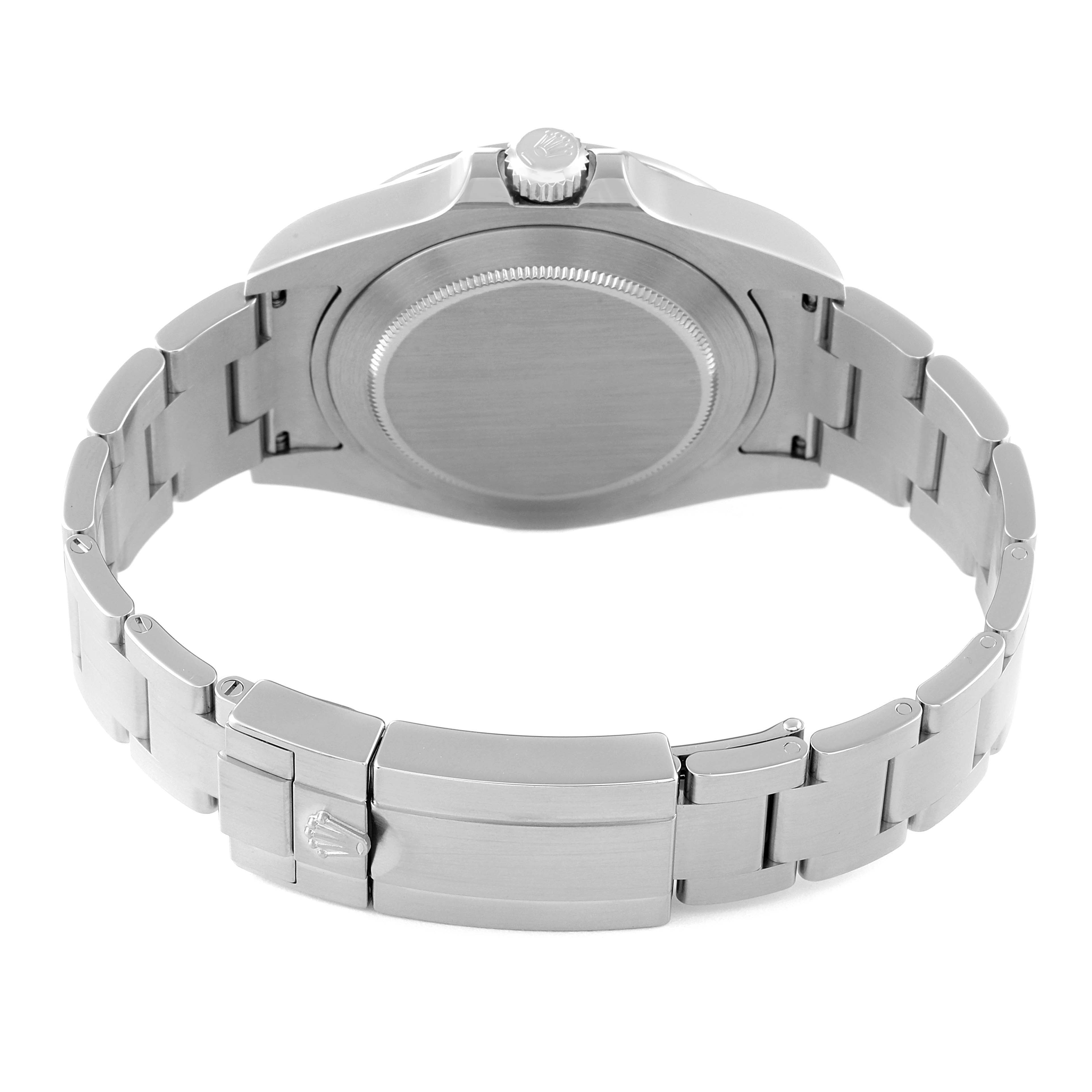 The image shows the back view of a Rolex Explorer 216570 Men's Stainless Steel Black Dial 216570 Men's Stainless Steel Black Dial model watch with its bracelet and clasp visible.