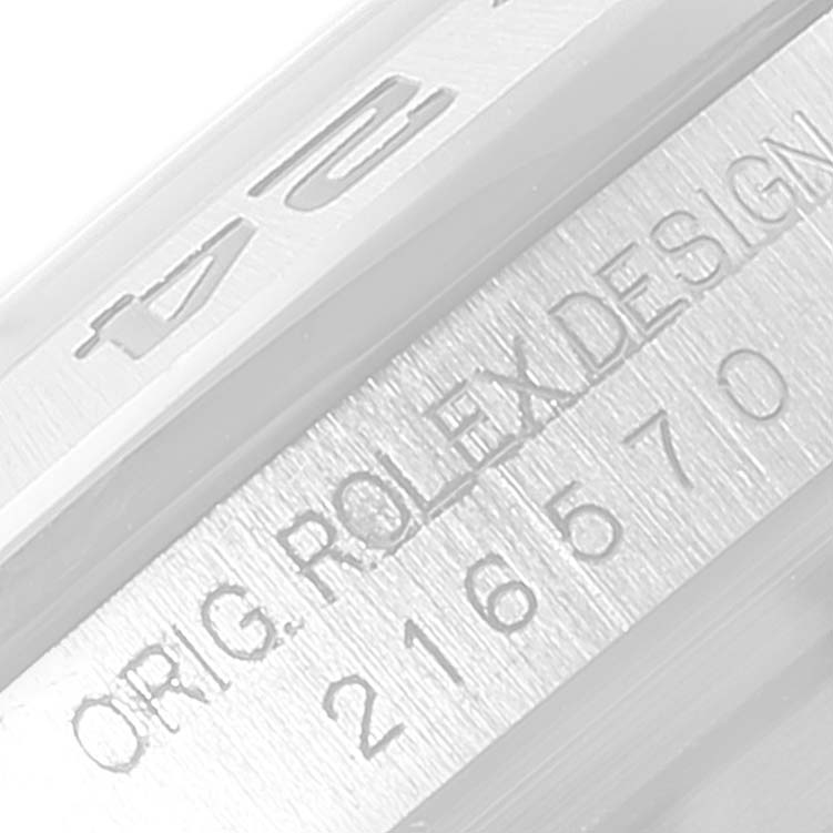 The image shows a close-up view of the engraving on the side of a Rolex Explorer 216570 Men's Stainless Steel Black Dial 216570 Men's Stainless Steel Black Dial watch.