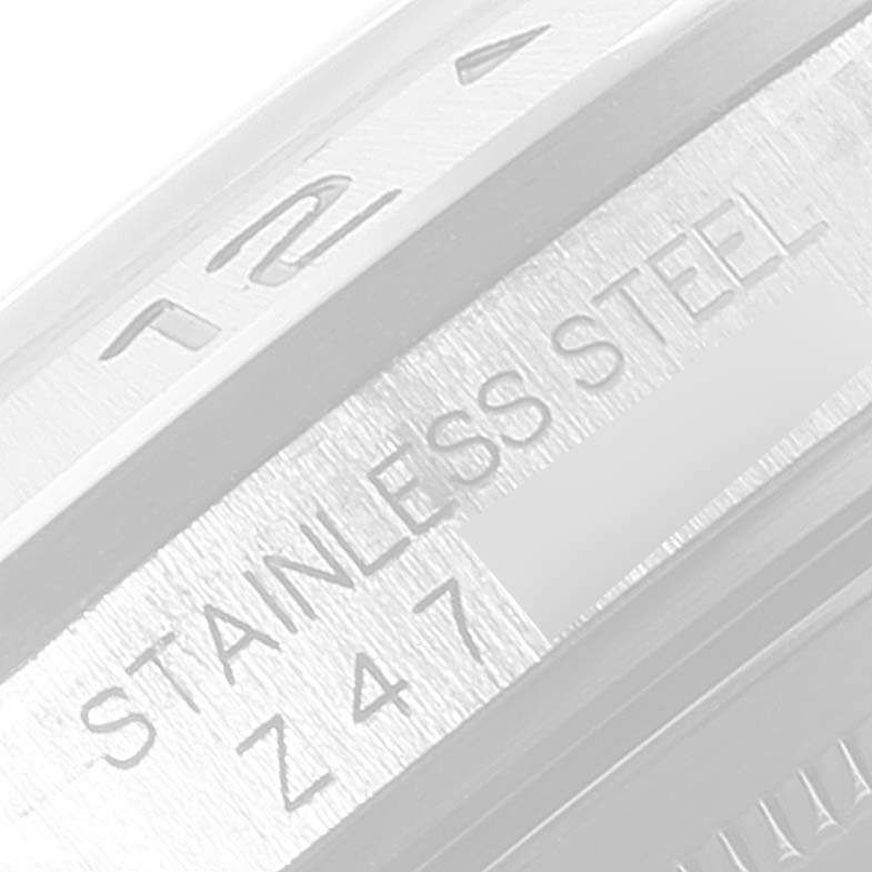 The image shows a close-up of the casing and inner bezel of a Rolex Explorer 16570 Men
s Stainless Steel Black Dial 16570 Men
s Stainless Steel Black Dial watch, with "STAINLESS STEEL" and "Z47" inscribed.