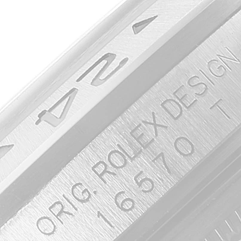 The image shows a close-up of the bezel and case engravings on a Rolex Explorer 16570 Men
s Stainless Steel Black Dial 16570 Men
s Stainless Steel Black Dial watch.