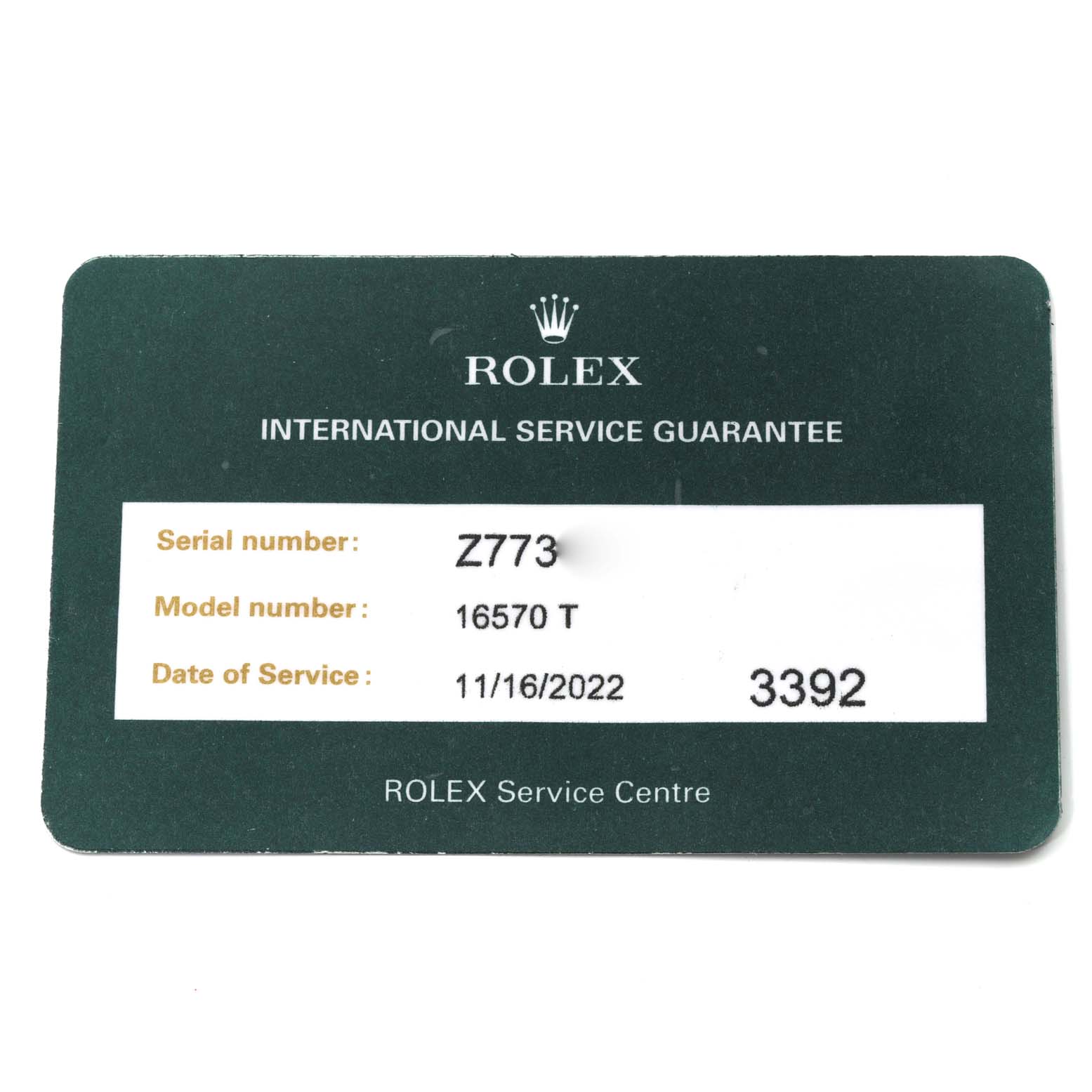The image shows a Rolex International Service Guarantee card for the Rolex Explorer 16570T Men
s Stainless Steel Black Dial 16570T Men
s Stainless Steel Black Dial model 16570 T.