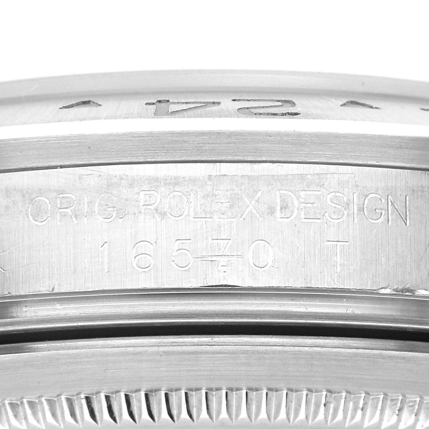 This image shows the side engraving of the case back from a Rolex Explorer 16570T Men
s Stainless Steel Black Dial 16570T Men
s Stainless Steel Black Dial model watch, featuring the text "ORIG. ROLEX DESIGN 16570 T."