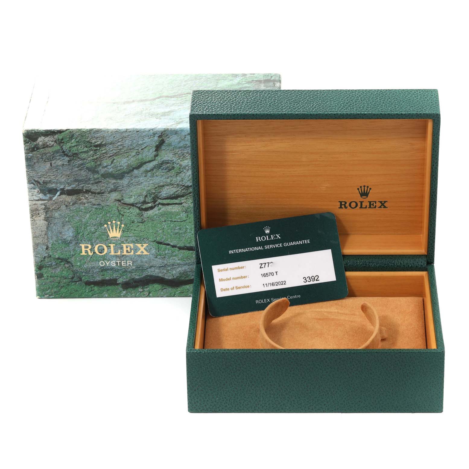 The image shows a Rolex Explorer 16570T Men
s Stainless Steel Black Dial 16570T Men
s Stainless Steel Black Dial model watch box, an outer box, and an International Service Guarantee card, viewed from the front angle.