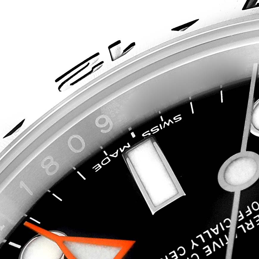 The image shows a close-up angle of the dial and part of the bezel of the Rolex Explorer 216570 Men
s Stainless Steel Black Dial 216570 Men
s Stainless Steel Black Dial watch, highlighting the hour markers and "Swiss Made" text.