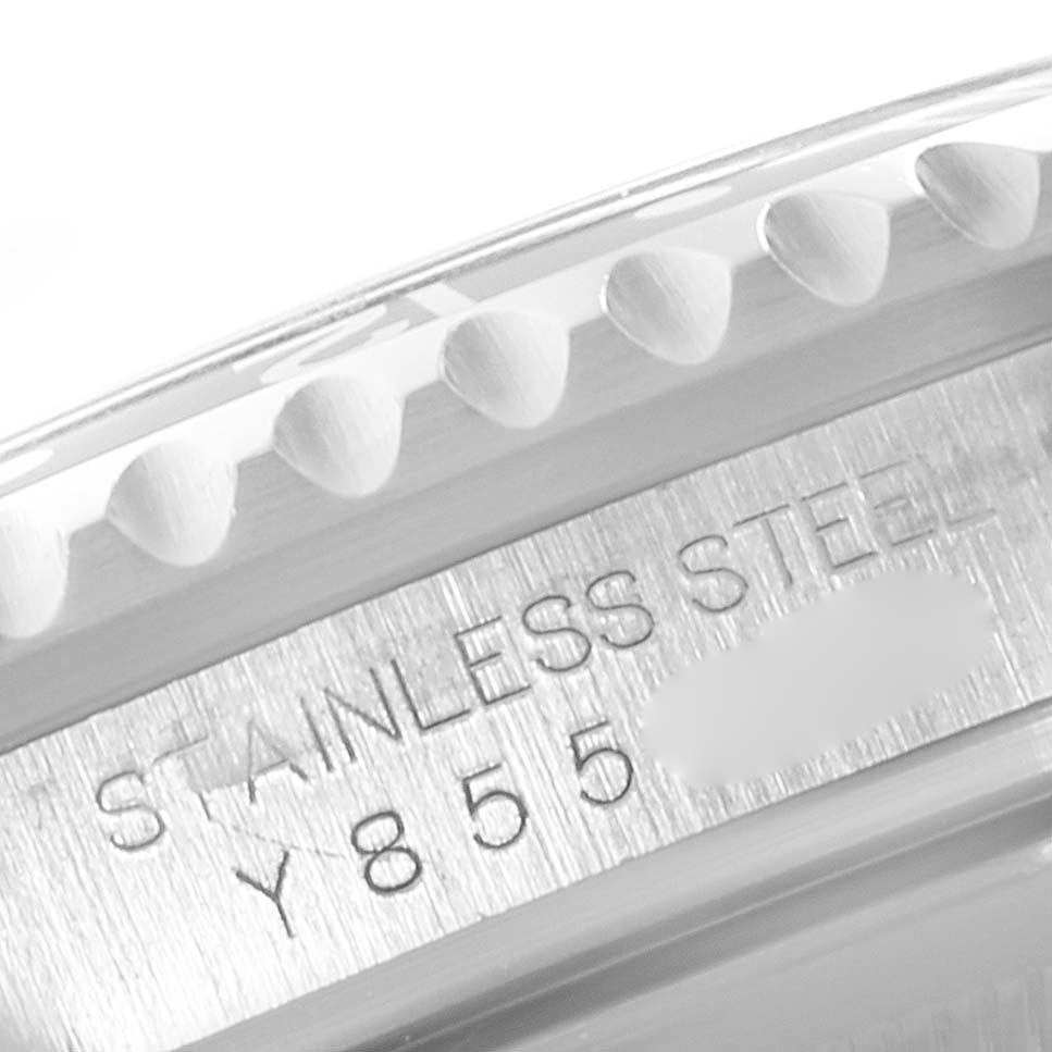This close-up image shows the bezel and serial number engraving on the stainless steel case of a Rolex GMT-Master 16710 Men
s Stainless Steel Black Dial 16710 Men
s Stainless Steel Black Dial.