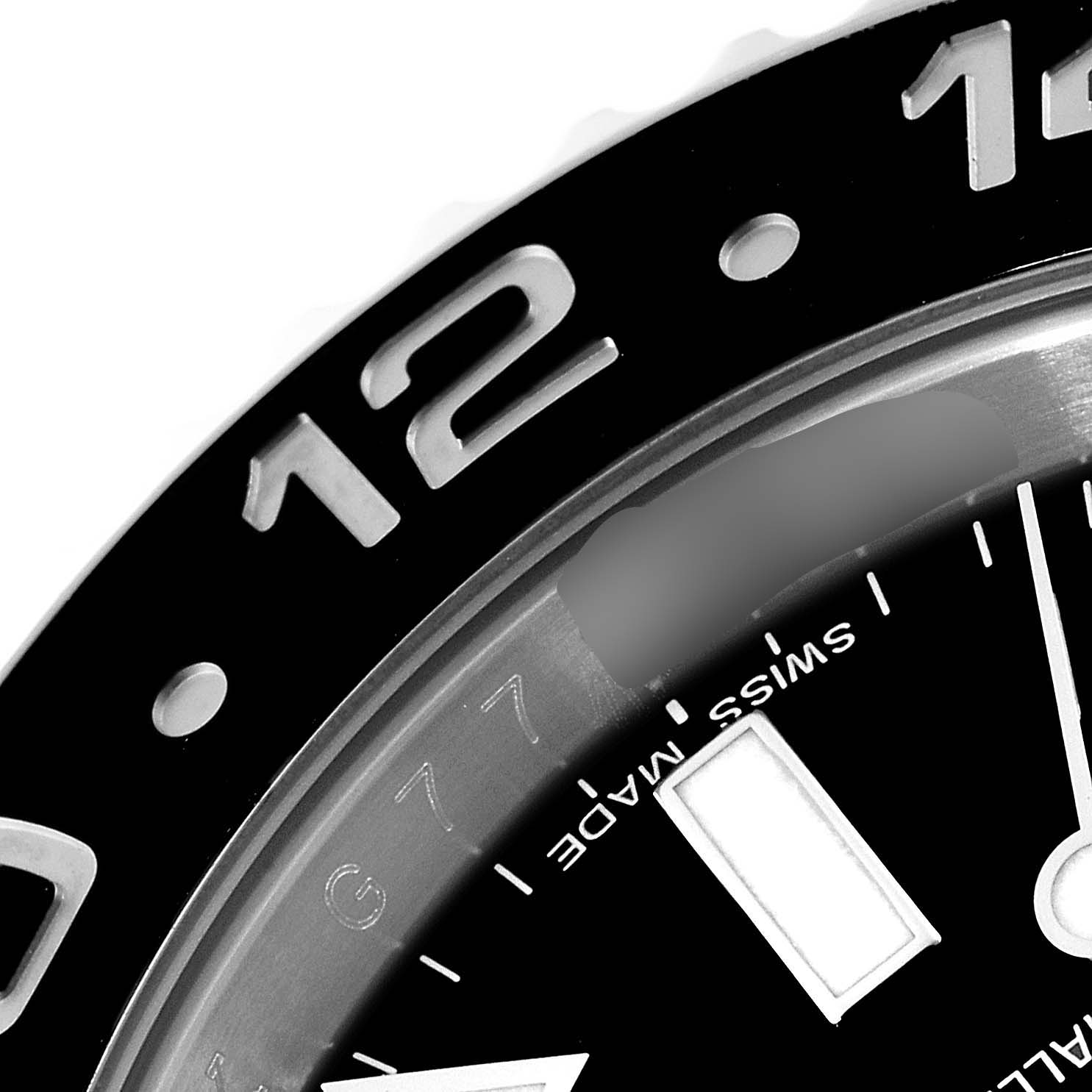 The image shows a close-up of the bezel and part of the dial of a Rolex GMT-Master 116710 Men
s Stainless Steel Black Dial 116710 Men
s Stainless Steel Black Dial watch.