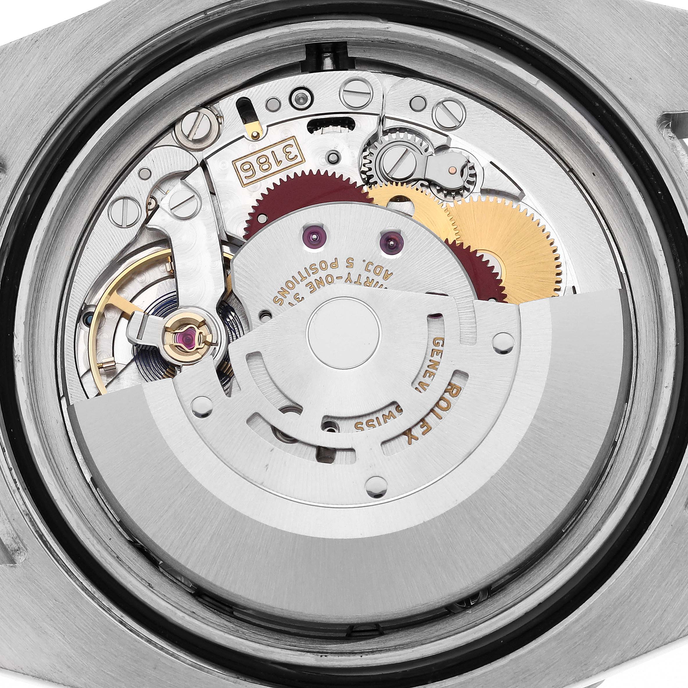 The image shows an interior view of the Rolex GMT-Master 116710 Men
s Stainless Steel Black Dial 116710 Men
s Stainless Steel Black Dial watch, focusing on the intricate details of its movement mechanism.