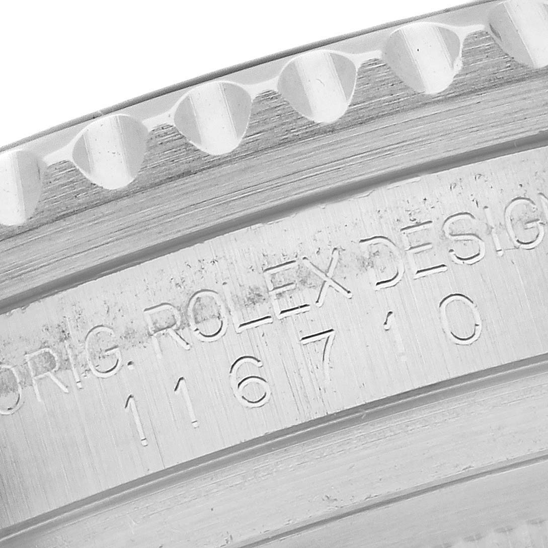 This close-up image shows the engraved side of the bezel and inner ring of a Rolex GMT-Master 116710 Men
s Stainless Steel Black Dial 116710 Men
s Stainless Steel Black Dial watch.
