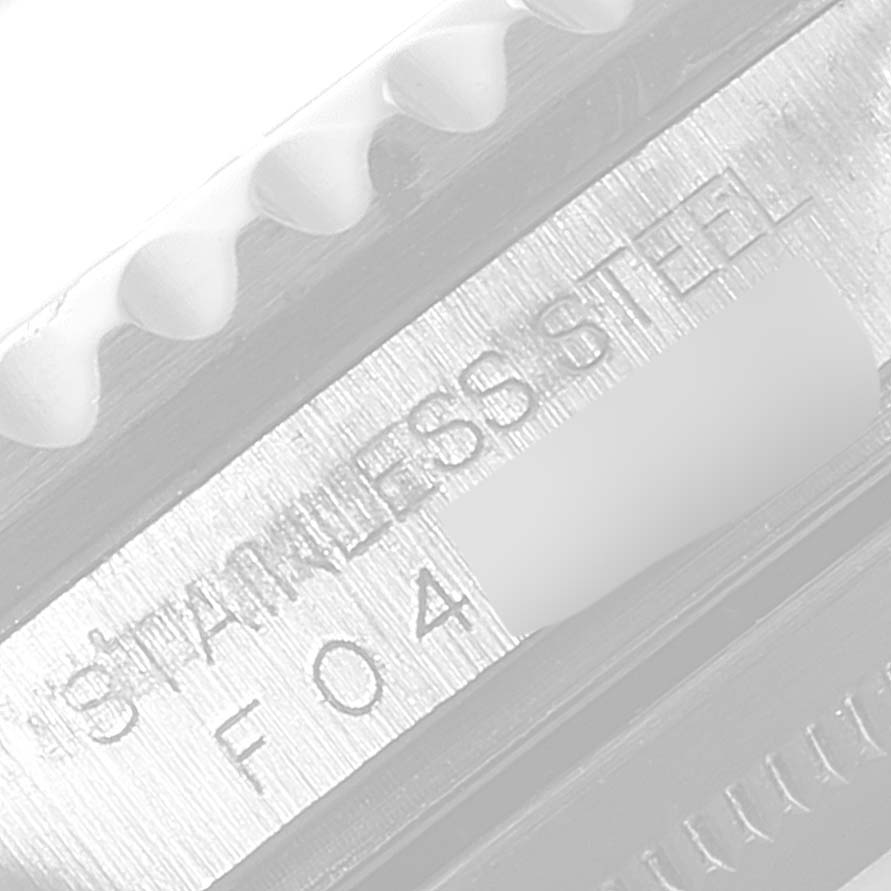 This image showcases a close-up of the side of a stainless steel Rolex GMT-Master 16710 Men
s Stainless Steel Black Dial 16710 Men
s Stainless Steel Black Dial watch, focusing on the engravings.