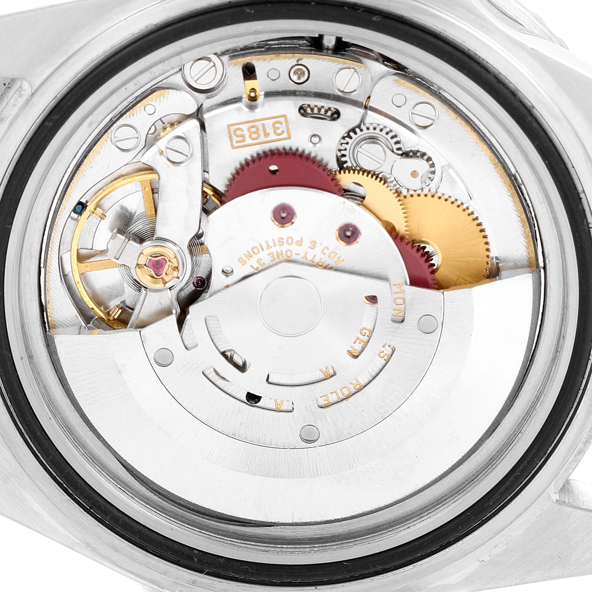 The image displays the movement of a Rolex GMT-Master 16710 Men
s Stainless Steel Black Dial 16710 Men
s Stainless Steel Black Dial watch from a rear-view angle, showcasing its internal mechanisms.