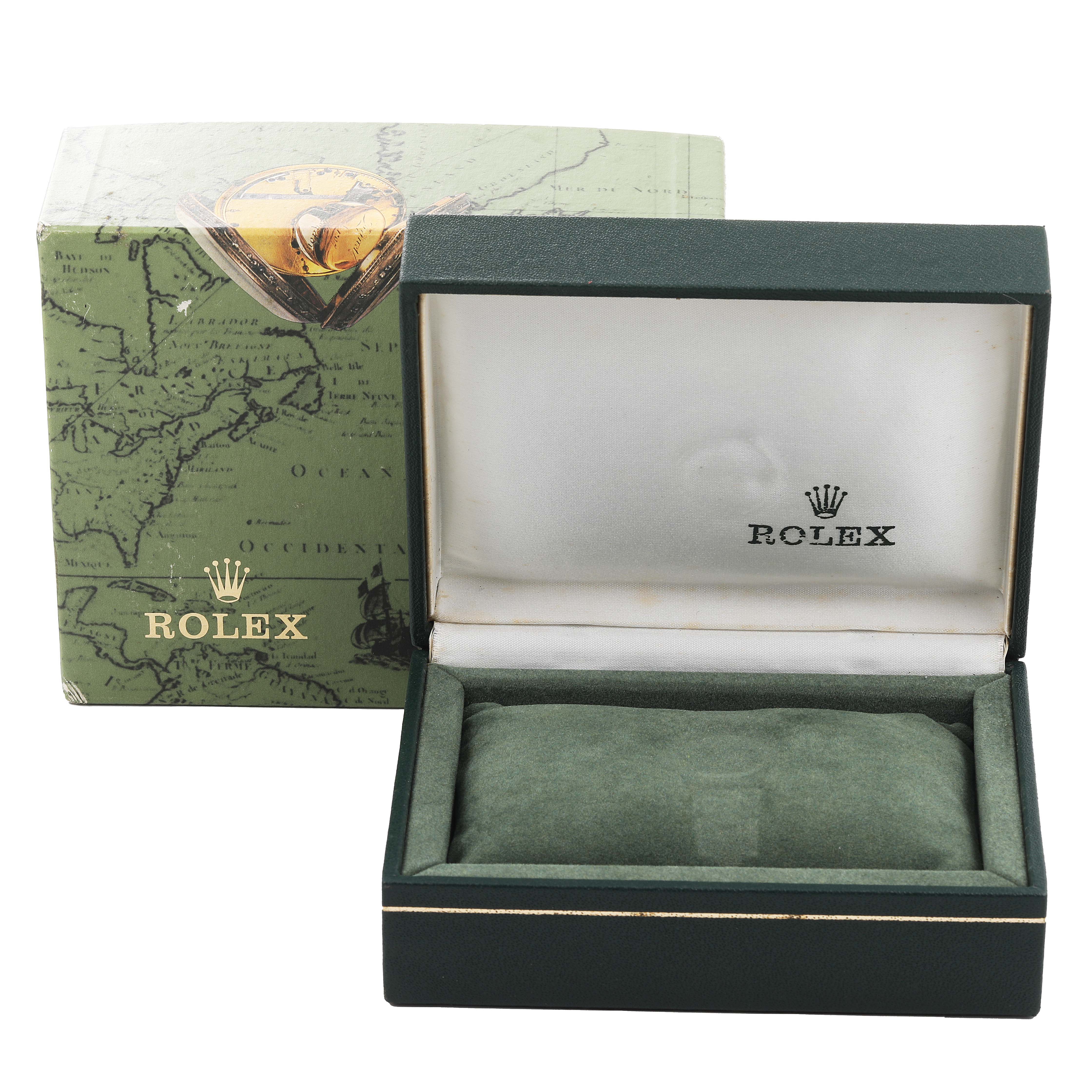 This image shows an empty green Rolex watch box and its outer packaging, featuring the logo and brand name prominently.