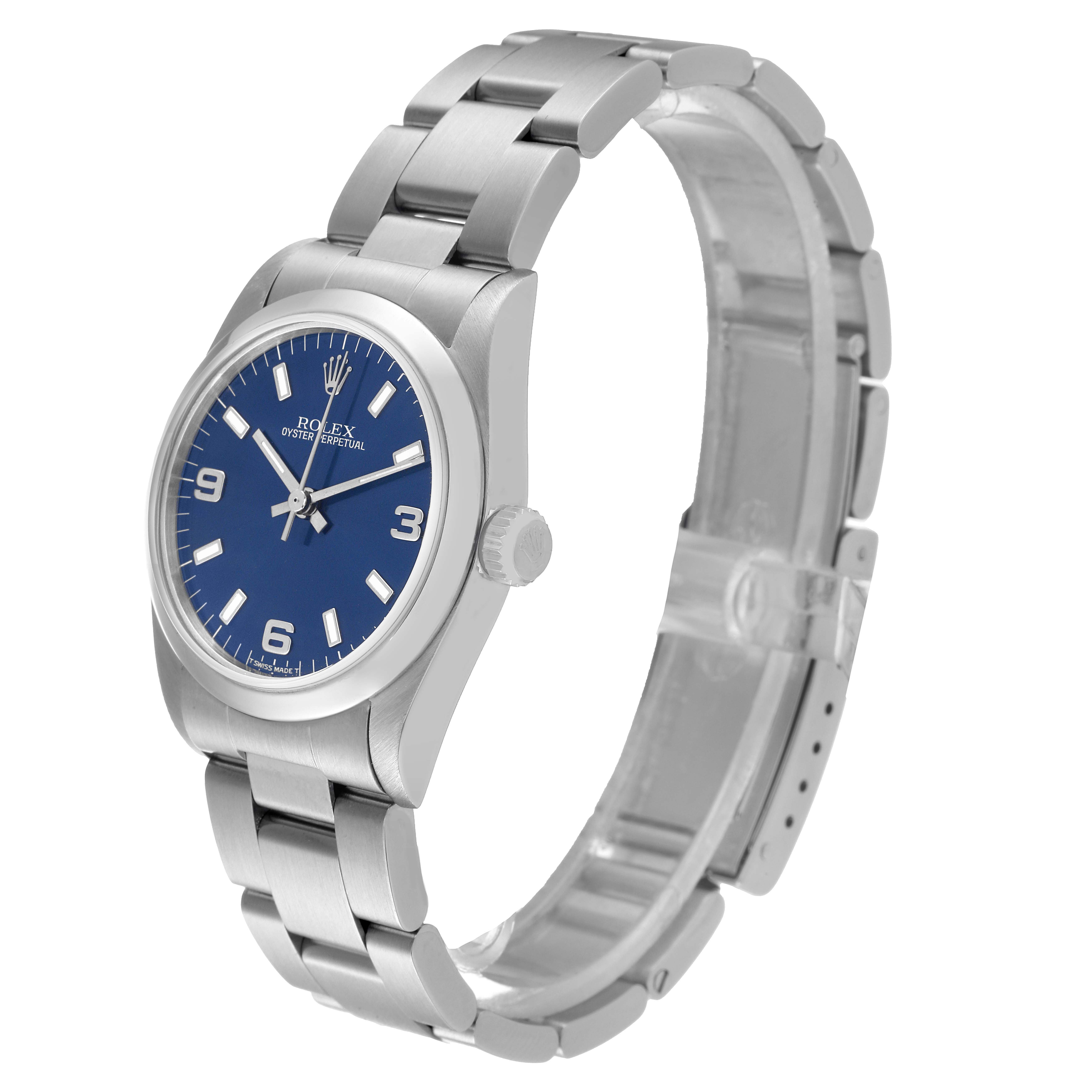 This is a side angle of a Rolex Mid-Size 67480 Women's Stainless Steel Blue Dial 67480 Women's Stainless Steel Blue Dial Oyster Perpetual watch, showing the dial, bezel, bracelet, and crown.
