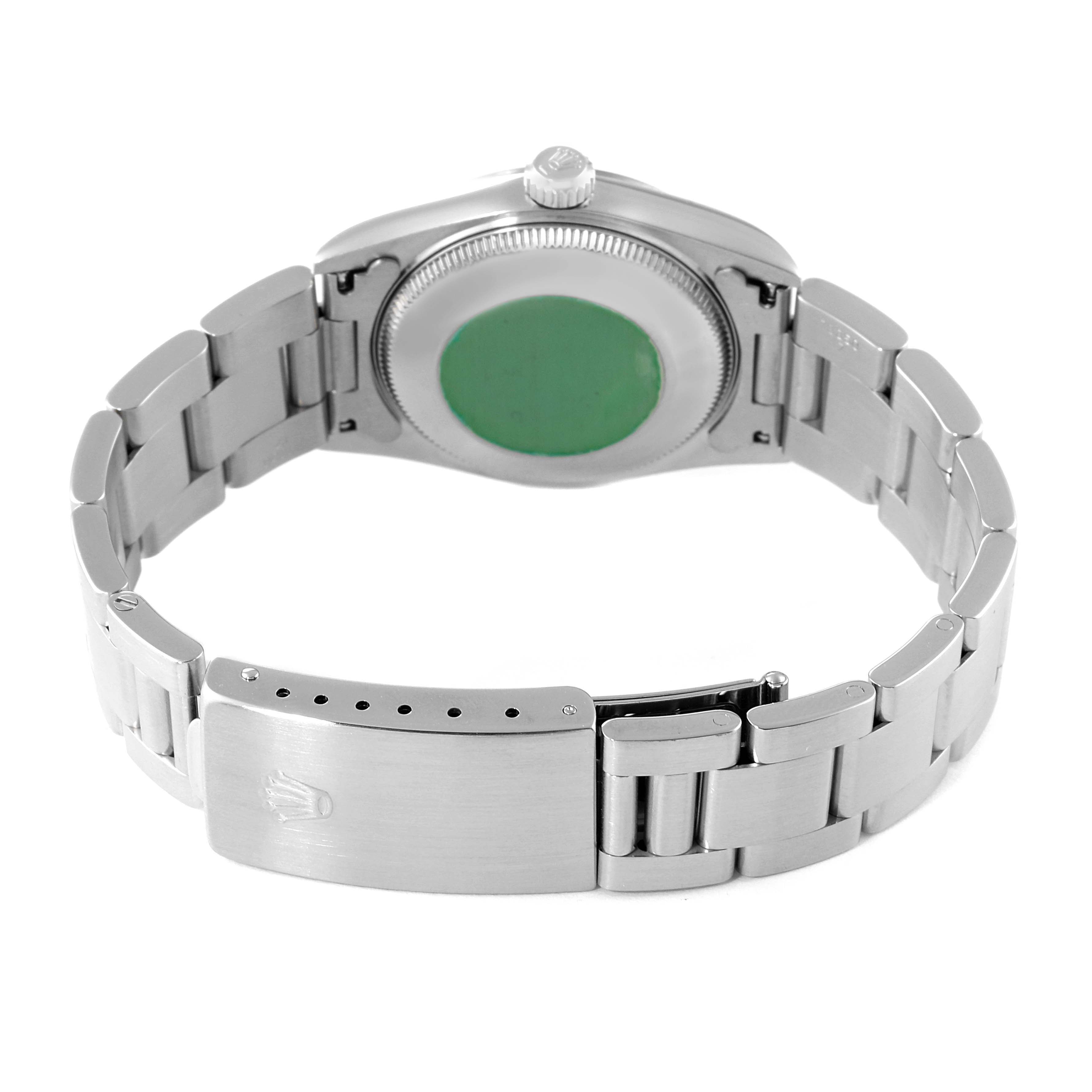 The image shows the backside and bracelet of a Mid-Size Rolex watch, prominently displaying the case back and clasp.