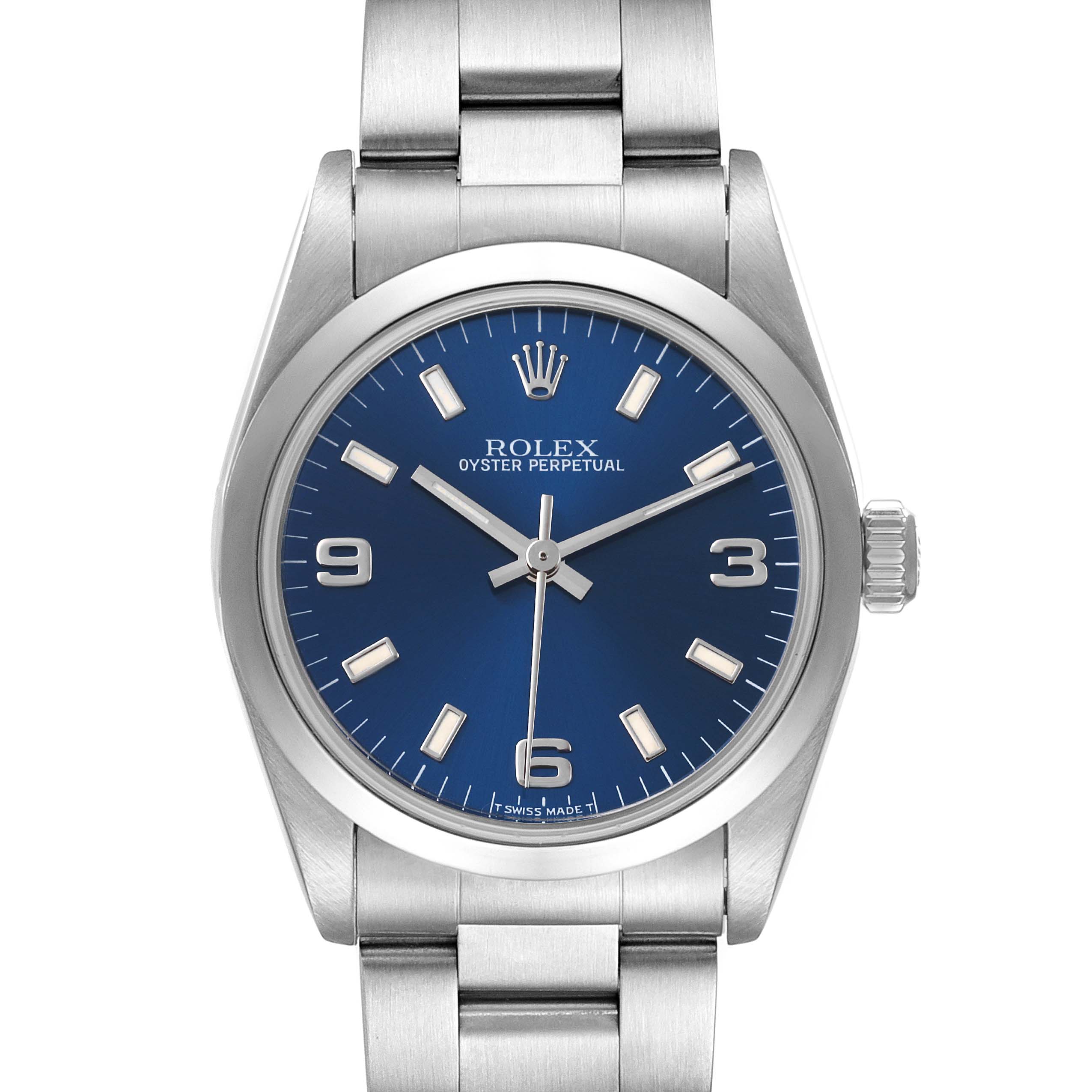 The image shows a front view of the Rolex Mid-Size 67480 Women
s Stainless Steel Blue Dial 67480 Women
s Stainless Steel Blue Dial Oyster Perpetual watch with a blue dial and metal bracelet.