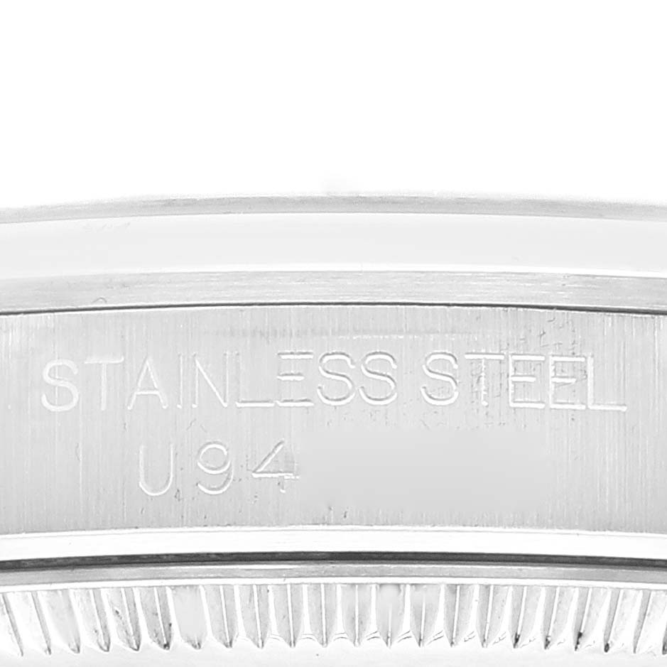 The image shows an engraved side view of the stainless steel casing on a Mid-Size Rolex watch.