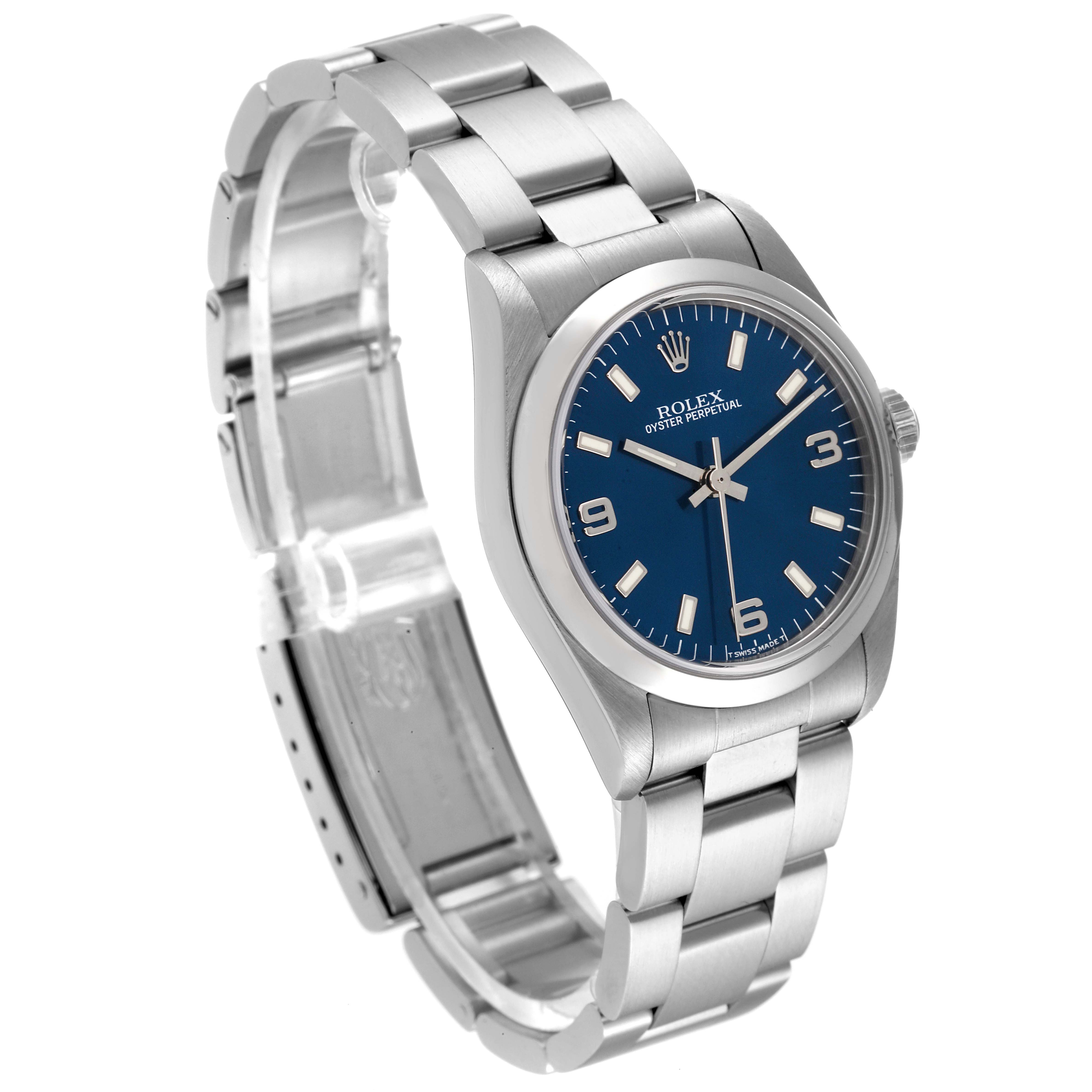 The Rolex Mid-Size 67480 Women
s Stainless Steel Blue Dial 67480 Women
s Stainless Steel Blue Dial model watch is shown at a slight angle, highlighting the face, bezel, and part of the bracelet.