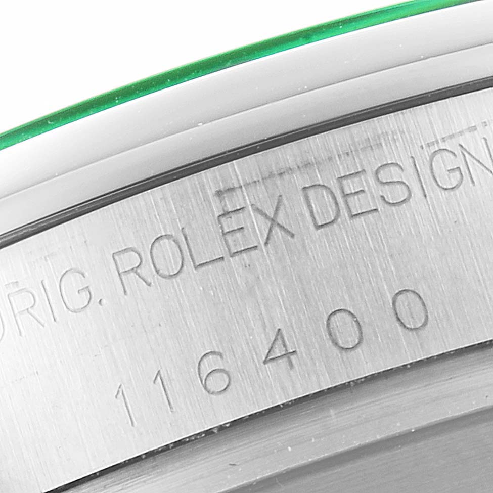 This image shows a close-up of the engraved case side with the serial number and "Orig. Rolex Design" of a Rolex Milgauss 116400V Men
s Stainless Steel Black Dial 116400V Men
s Stainless Steel Black Dial watch.