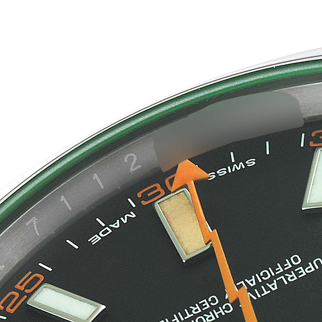 This close-up image shows the upper-left section of the dial of a Rolex Milgauss 116400V Men
s Stainless Steel Black Dial 116400V Men
s Stainless Steel Black Dial watch, featuring hour markers and a portion of the second hand.