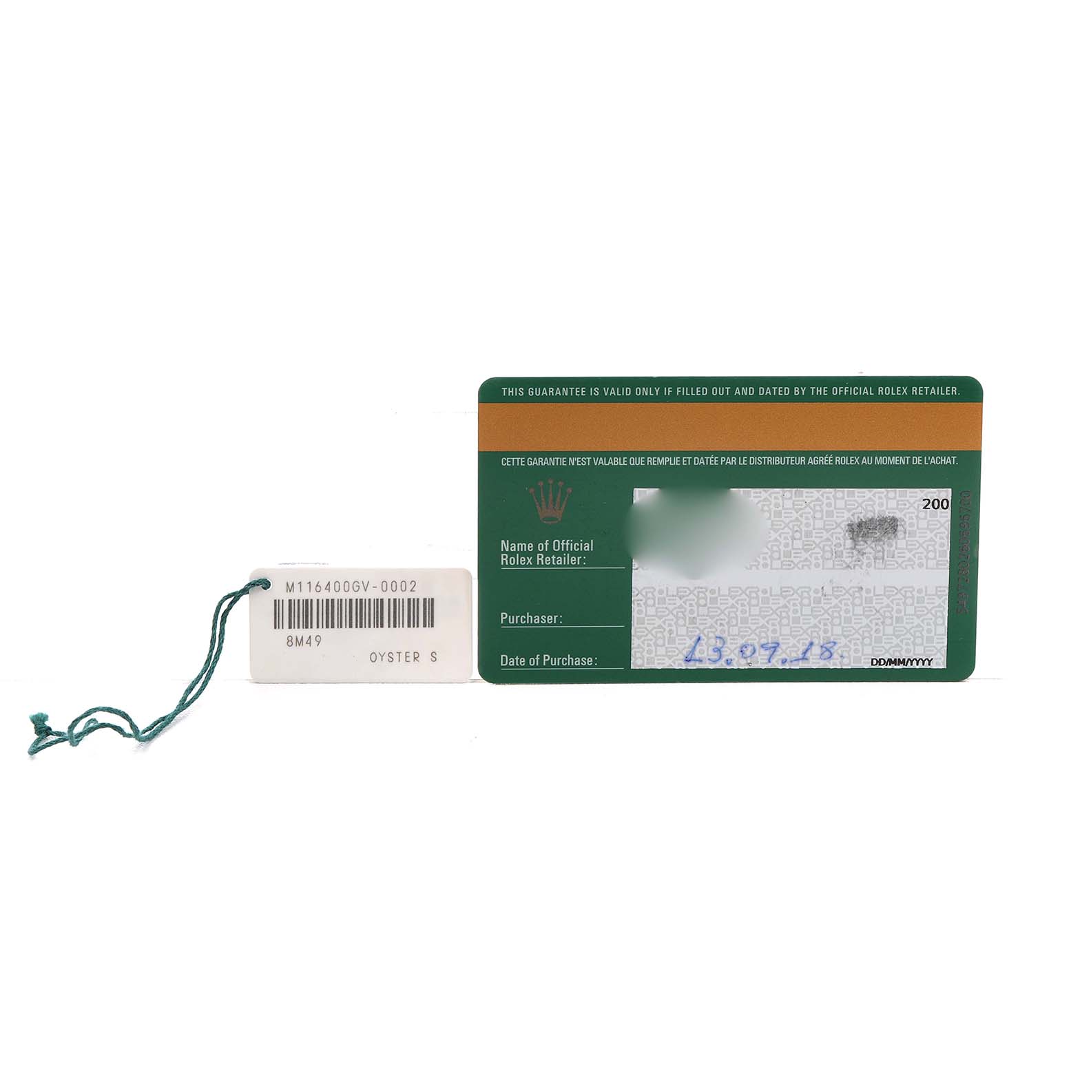 The image shows a warranty card and a tag for the Rolex Milgauss M116400GV Men's Stainless Steel Blue Dial.