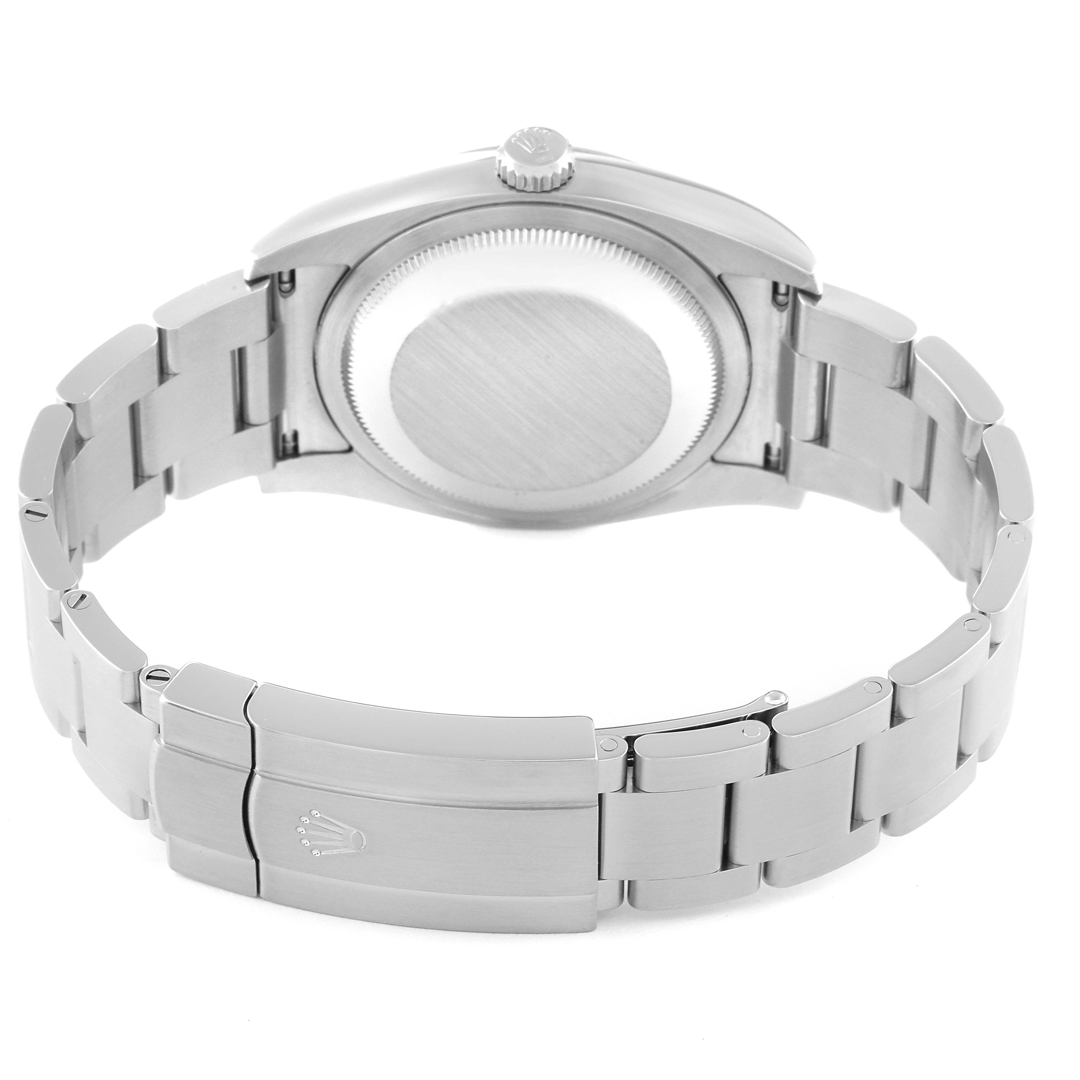 The image shows the back view of a Rolex Oyster Perpetual 116000 Men
s Stainless Steel Black Dial 116000 Men
s Stainless Steel Black Dial watch, displaying its case back and deployment clasp.