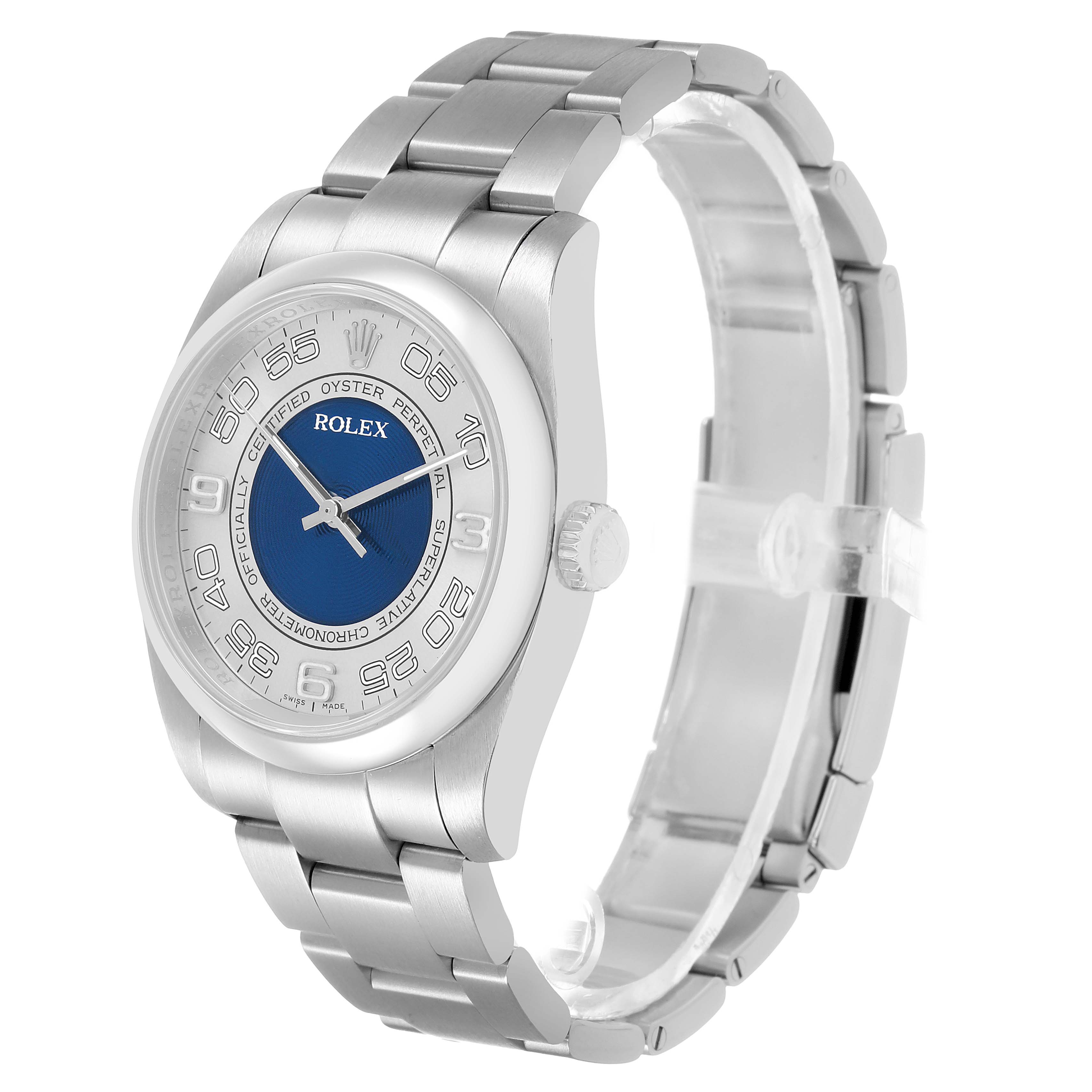 The Rolex Oyster Perpetual 116000 Men's Stainless Steel Silver Dial watch is shown at a three-quarter angle, highlighting the dial, crown, case, and bracelet.