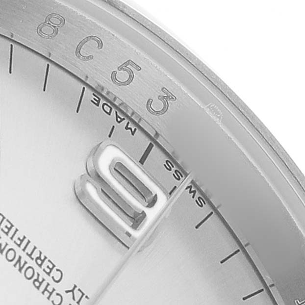 The image shows a close-up of the dial and number marker of the Rolex Oyster Perpetual 116000 Men's Stainless Steel Silver Dial, focusing on the 10 o'clock position.