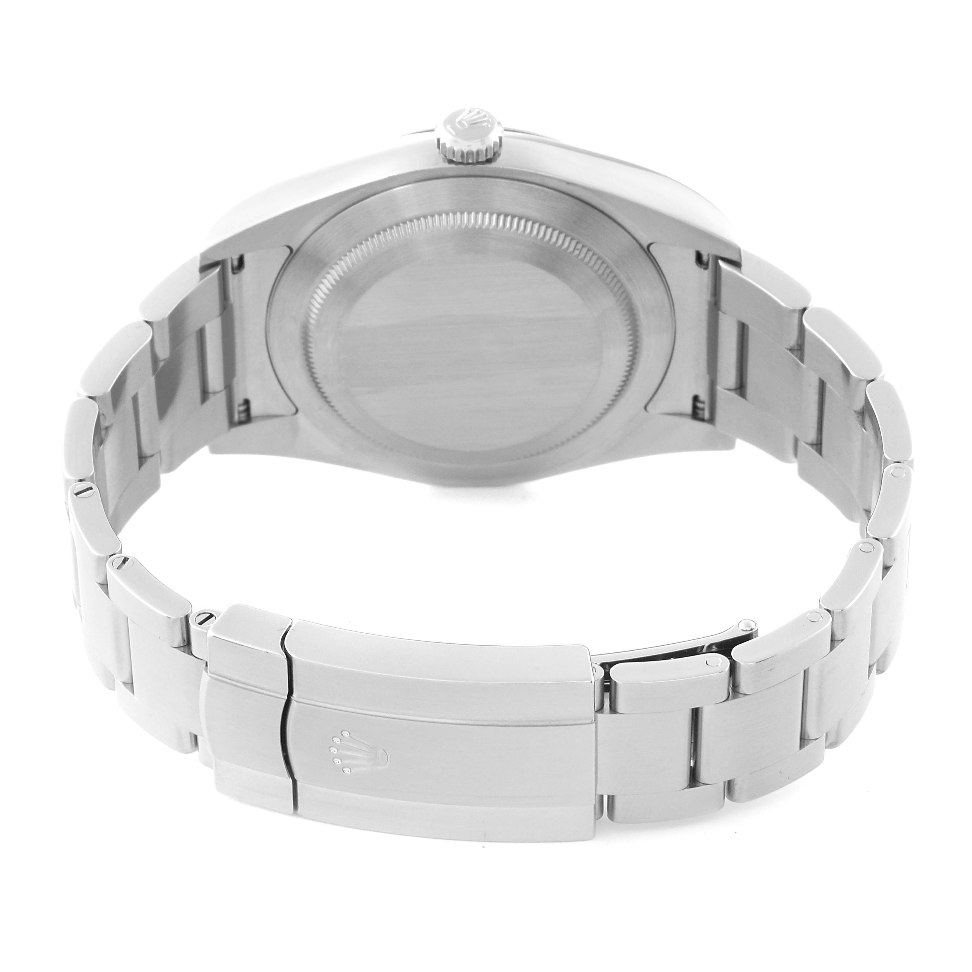 The image shows the back case and bracelet clasp of a Rolex Oyster Perpetual 114300 Men
s Stainless Steel Blue Dial 114300 Men
s Stainless Steel Blue Dial watch from a rear angle.