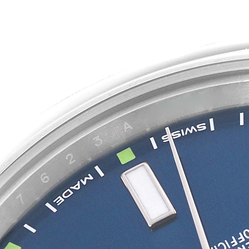 This image shows a close-up of the dial and indices of a Rolex Oyster Perpetual 114300 Men
s Stainless Steel Blue Dial 114300 Men
s Stainless Steel Blue Dial watch.