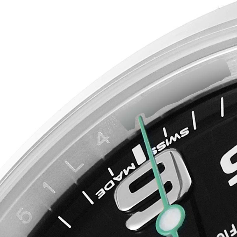 This close-up image of a Rolex Air-King 116900 Men's Stainless Steel Black Dial 116900 Men's Stainless Steel Black Dial watch shows part of the dial, including the 9 o'clock numeral and the "Swiss Made" text.