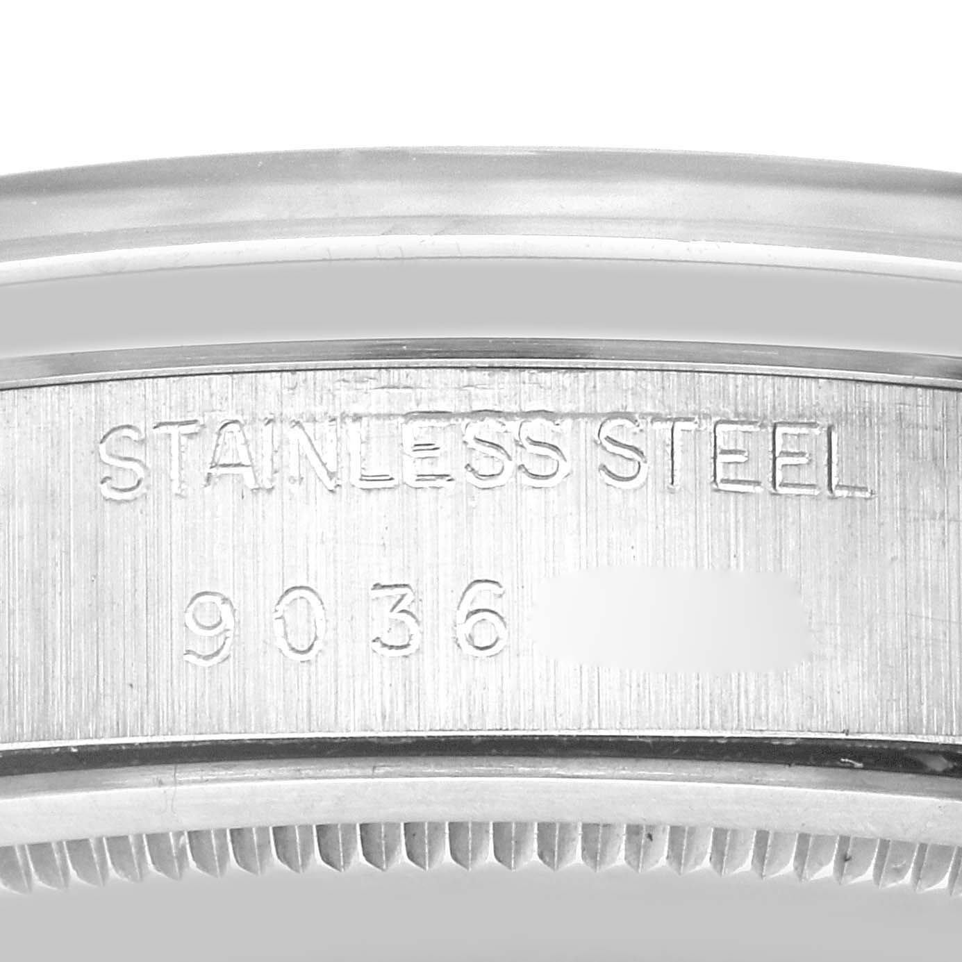 The image shows a close-up of the case back and serial number of a Vintage Collection Rolex watch.