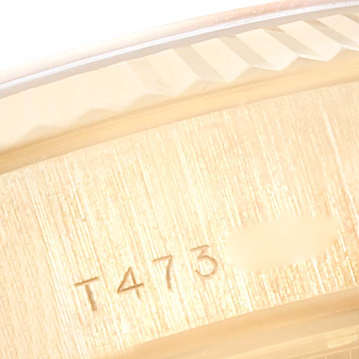 The image shows a close-up of the serial number and part of the bezel on a Rolex President 69178 Women
s Yellow Gold Champagne Dial 69178 Women
s Yellow Gold Champagne Dial model watch.