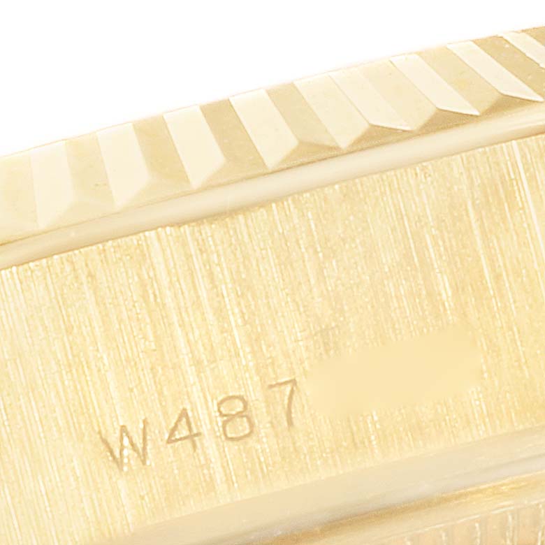 This close-up image of the Rolex President 69178 Women
s Yellow Gold Champagne Dial 69178 Women
s Yellow Gold Champagne Dial watch shows part of the case and the fluted bezel.