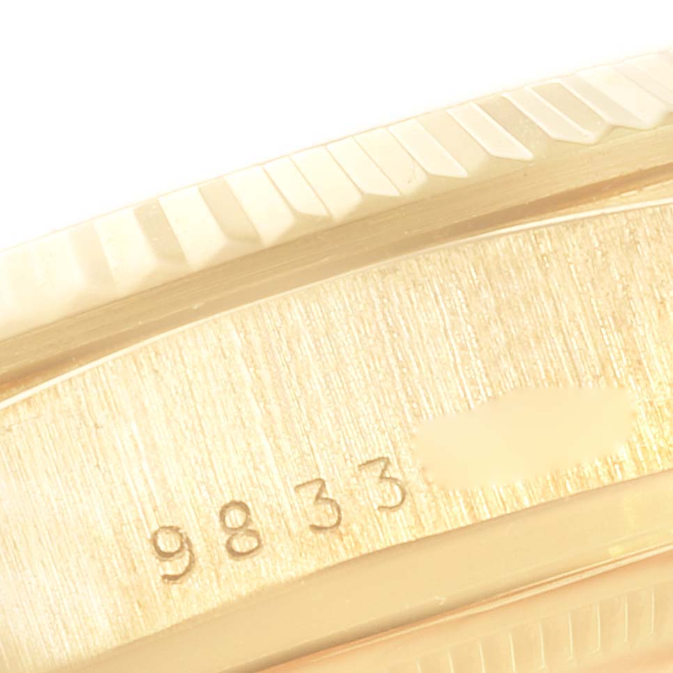 This close-up image shows the serial number engraving on the case of a Rolex President 18038 Men's Yellow Gold Silver Dial 18038 Men's Yellow Gold Silver Dial model watch.