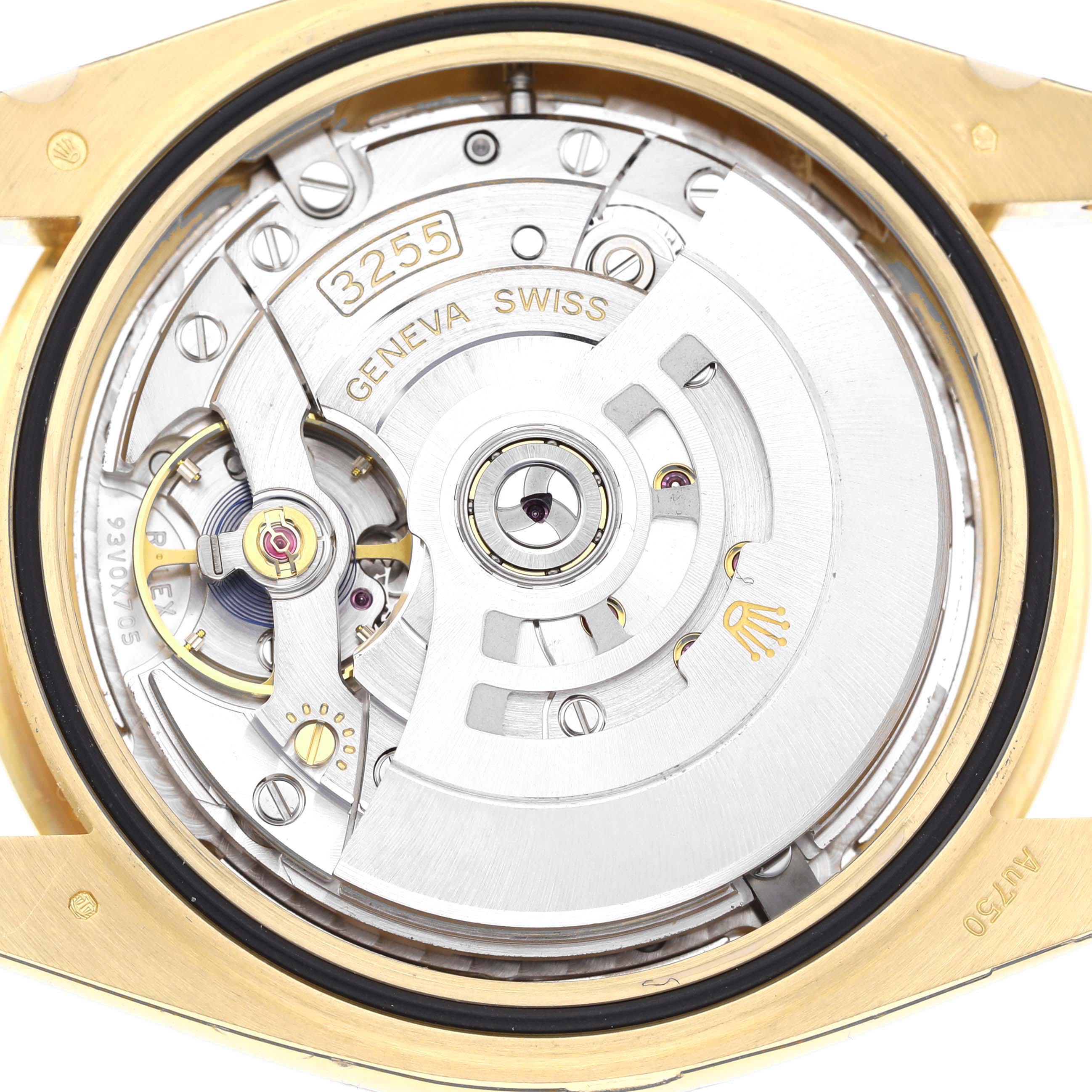 The image shows the case back open, revealing the movement of a Rolex President 228238 Men's Yellow Gold Silver Dial watch, highlighting its intricate mechanisms.