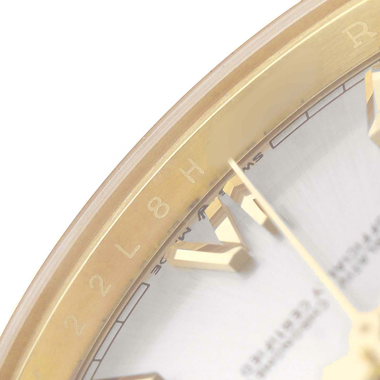 The image shows a close-up of the bezel and hour markers of a Rolex President 228238 Men's Yellow Gold Silver Dial watch.