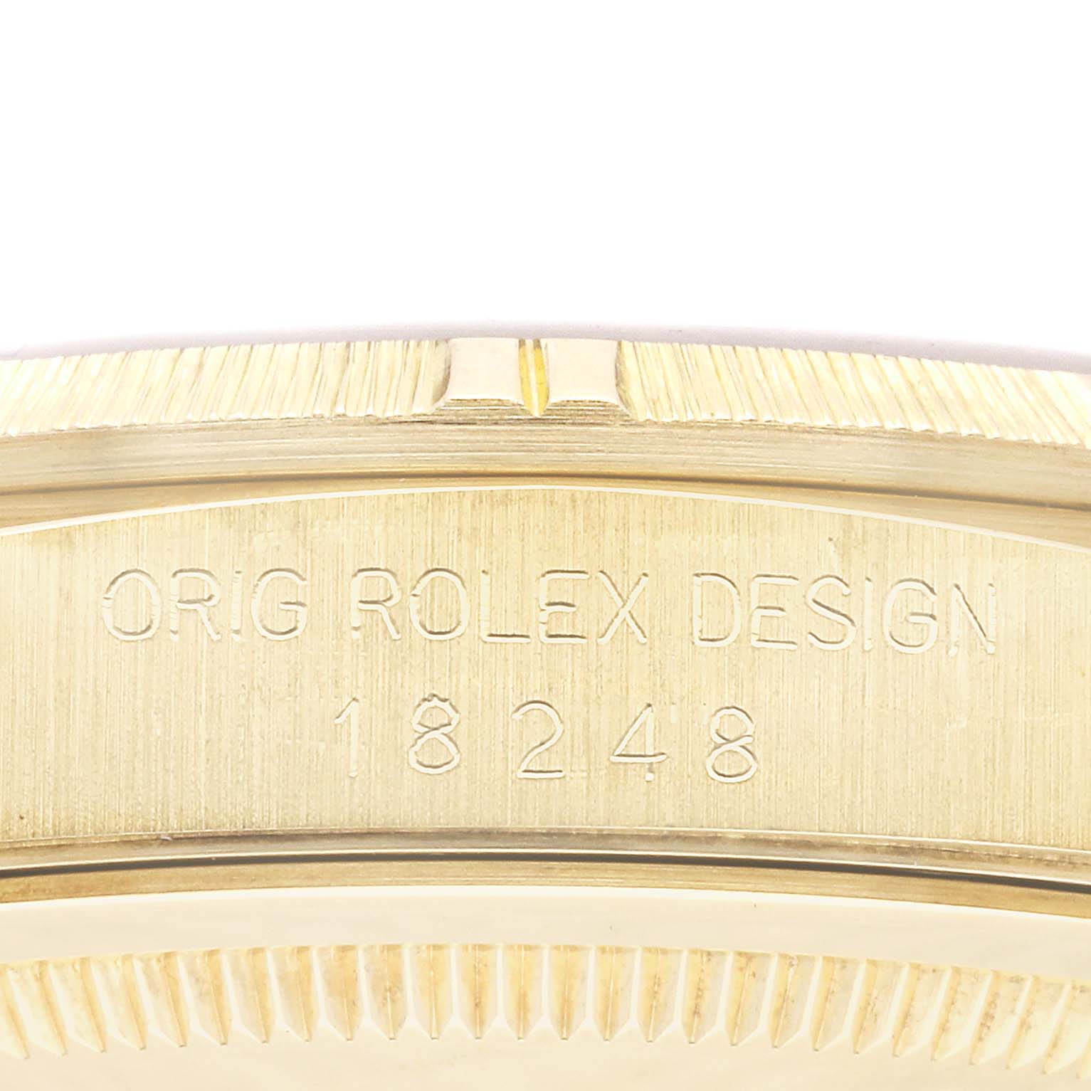 The image shows a close-up of the side engraving on the case band of a Rolex President 18248 Men
s Yellow Gold Champagne Dial 18248 Men
s Yellow Gold Champagne Dial model watch, displaying its model number.