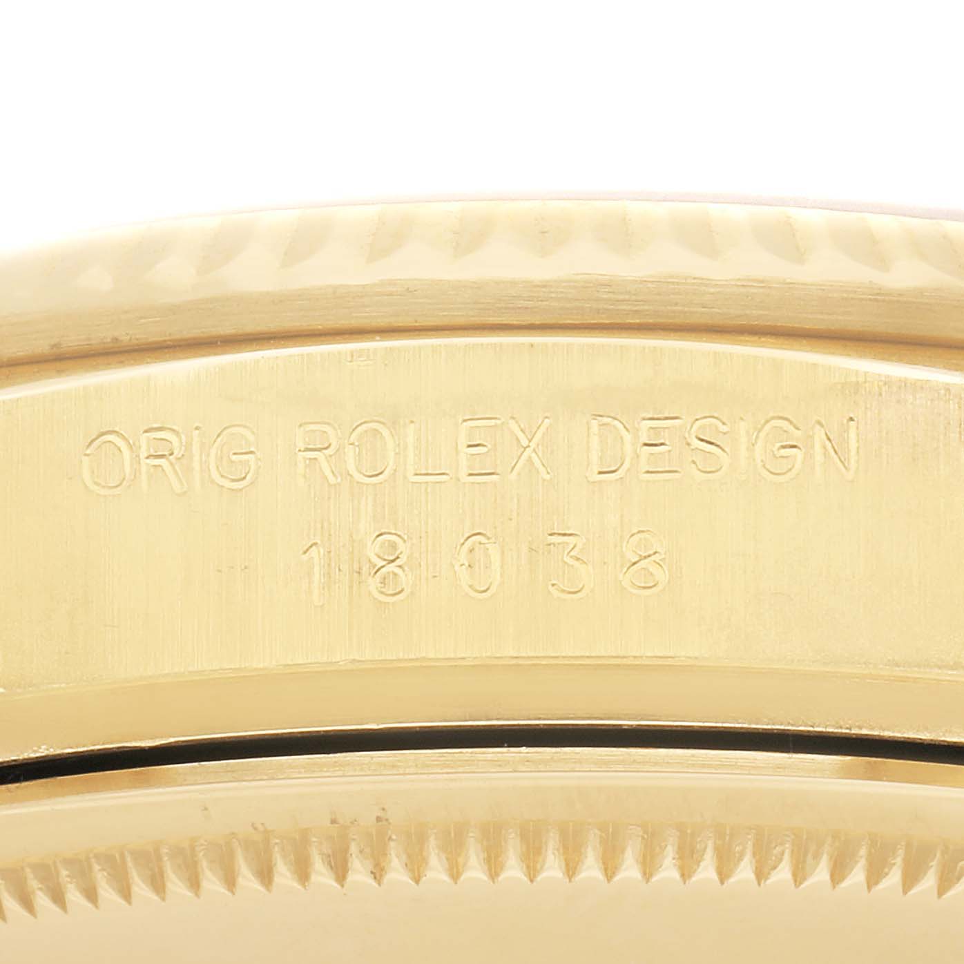 The image shows the side view of a Rolex President 18038 Men
s Yellow Gold Champagne Dial 18038 Men
s Yellow Gold Champagne Dial model, highlighting the case edge engraved with "ORIG ROLEX DESIGN 18038".