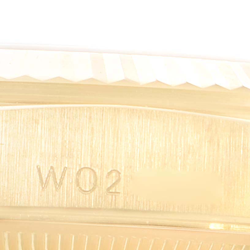 This close-up image shows the serial number engraving on the case of a Rolex President 18338 Men
s Yellow Gold Champagne Dial 18338 Men
s Yellow Gold Champagne Dial model watch.