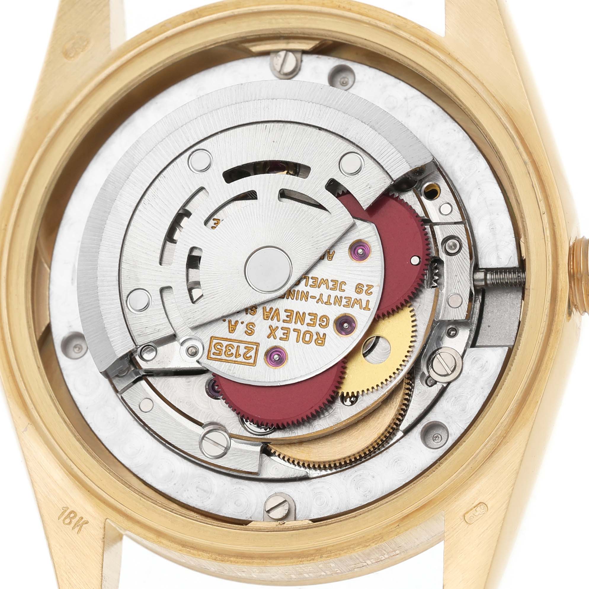 The image shows the movement of a Rolex Datejust 68238 Women's Yellow Gold Champagne Dial watch from a rear angle, exposing the rotor and intricate internal gears.