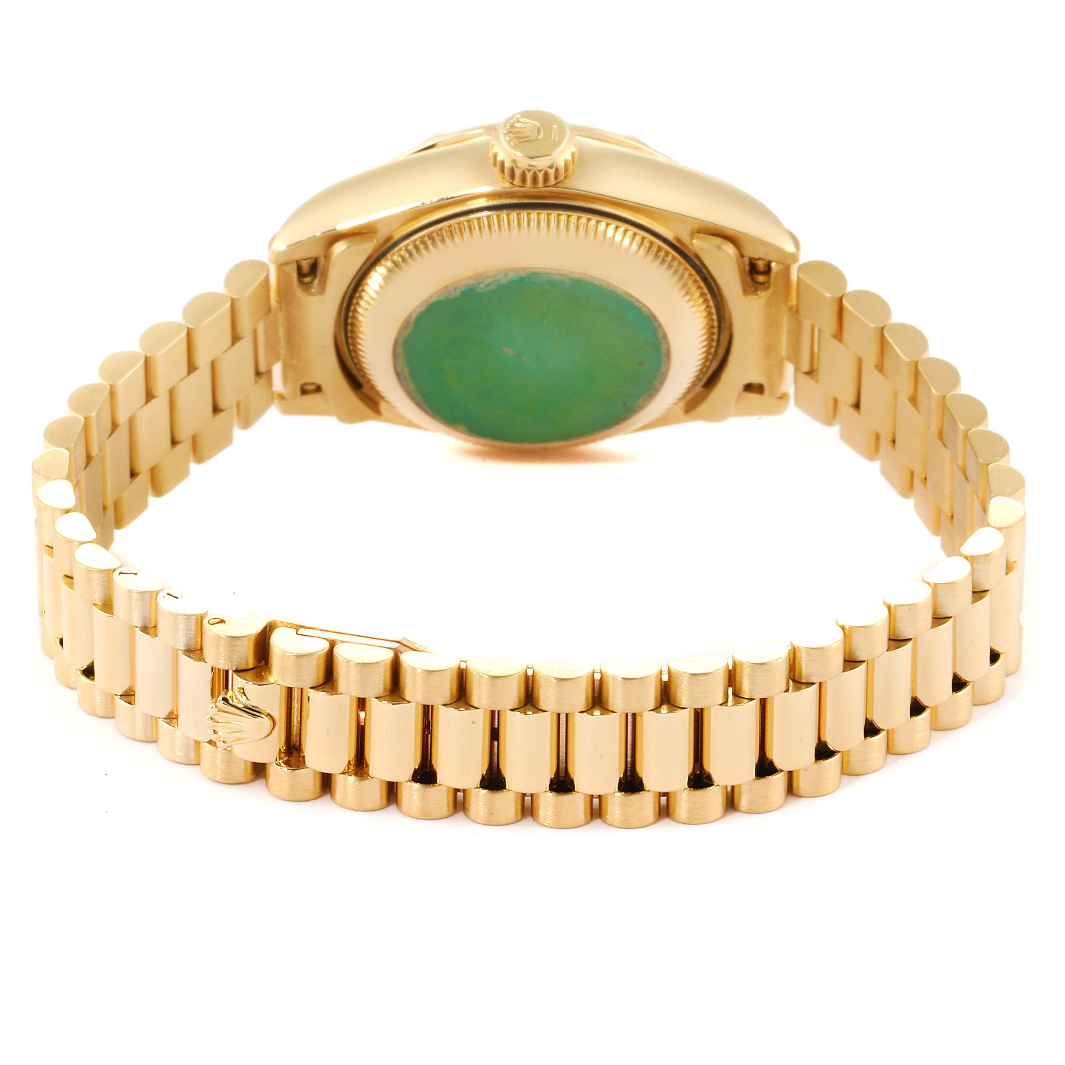 This image shows the back case and bracelet of a Rolex Pearlmaster 69258 Women's Yellow Gold Champagne Dial 69258 Women's Yellow Gold Champagne Dial watch from a slightly elevated angle.